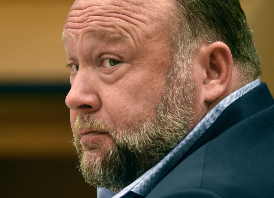 FILE - Infowars founder Alex Jones appears in court to testify during the Sandy Hook defamation damages trial at Connecticut Superior Court, Sept. 22, 2022, in Waterbury, Conn. Sandy Hook families who won nearly $1.5 billion in legal judgments against conspiracy theorist Jones for calling the 2012 Connecticut school shooting a hoax have offered to settle that debt for only pennies on the dollar — at least $85 million over 10 years. (Tyler Sizemore/Hearst Connecticut Media via AP, Pool, File)