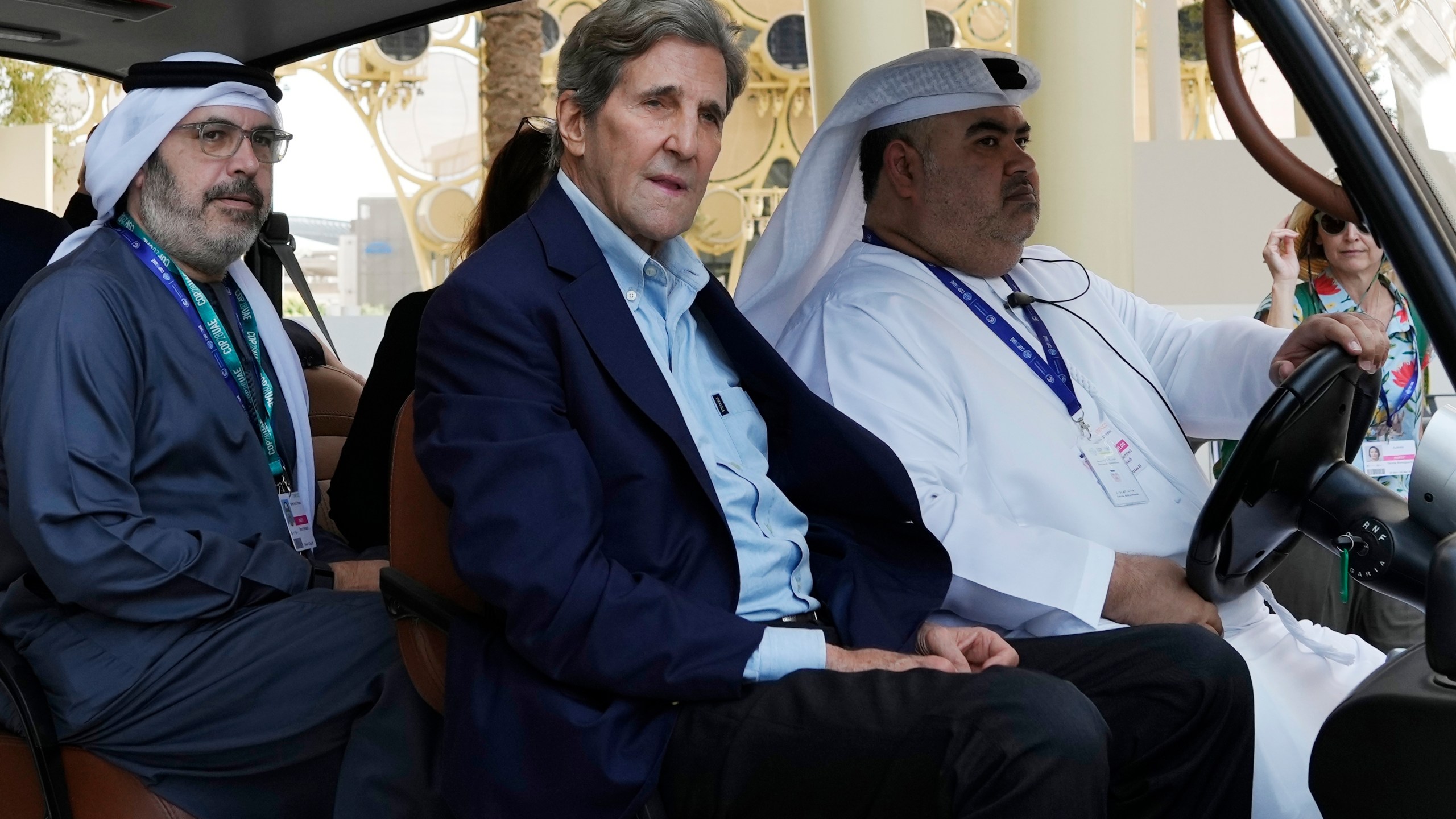 John Kerry, U.S. Special Presidential Envoy for Climate, rides in a cart ahead of the COP28 U.N. Climate Summit, Wednesday, Nov. 29, 2023, in Dubai, United Arab Emirates. (AP Photo/Peter Dejong)