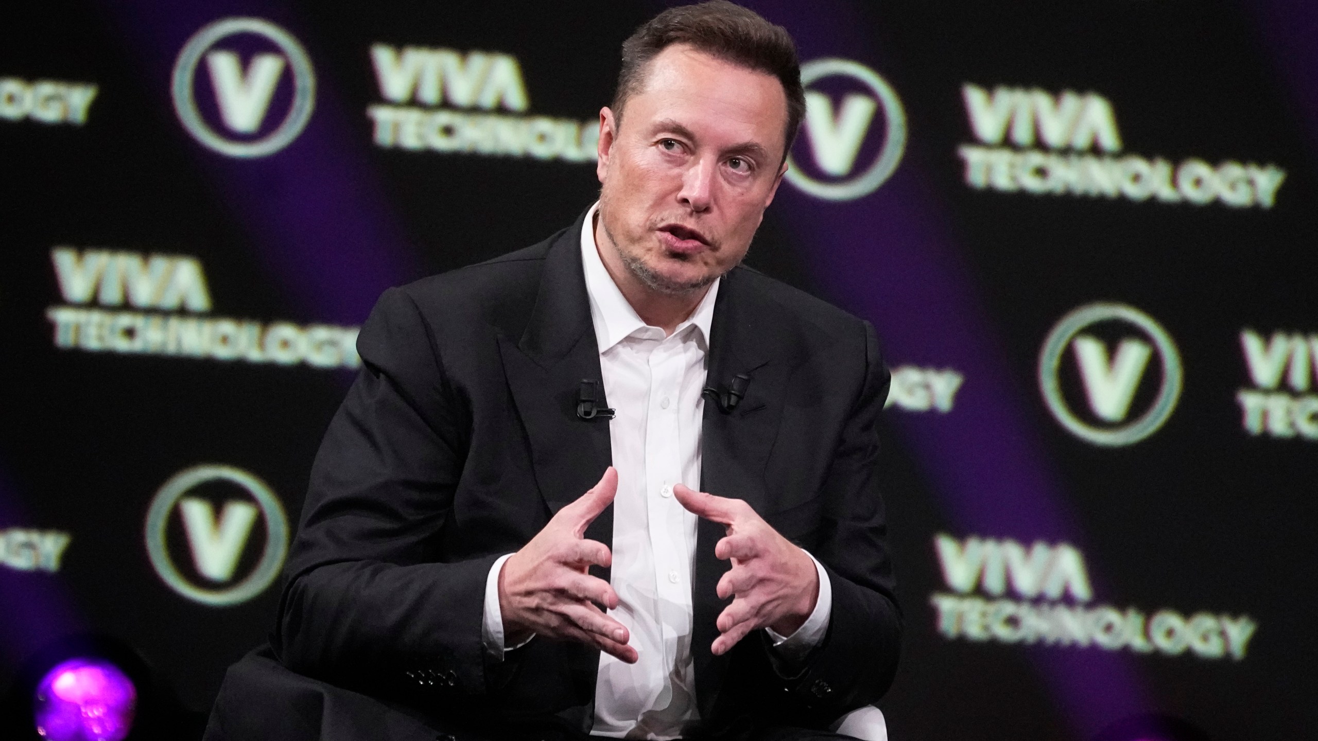 FILE - Elon Musk, who owns X, formerly known as Twitter, Tesla and SpaceX, speaks at the Vivatech fair, June 16, 2023, in Paris. Musk said Wednesday, Nov. 29, that advertisers who have halted spending on his social media platform X in response to antisemitic and other hateful material are engaging in “blackmail” and, using a profanity, essentially told them to go away. (AP Photo/Michel Euler, File)