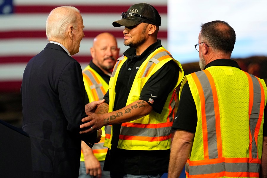 President Joe Biden greets workers after speaking at CS Wind, Wednesday, Nov. 29, 2023, in Pueblo, Colo. (AP Photo/Jack Dempsey)