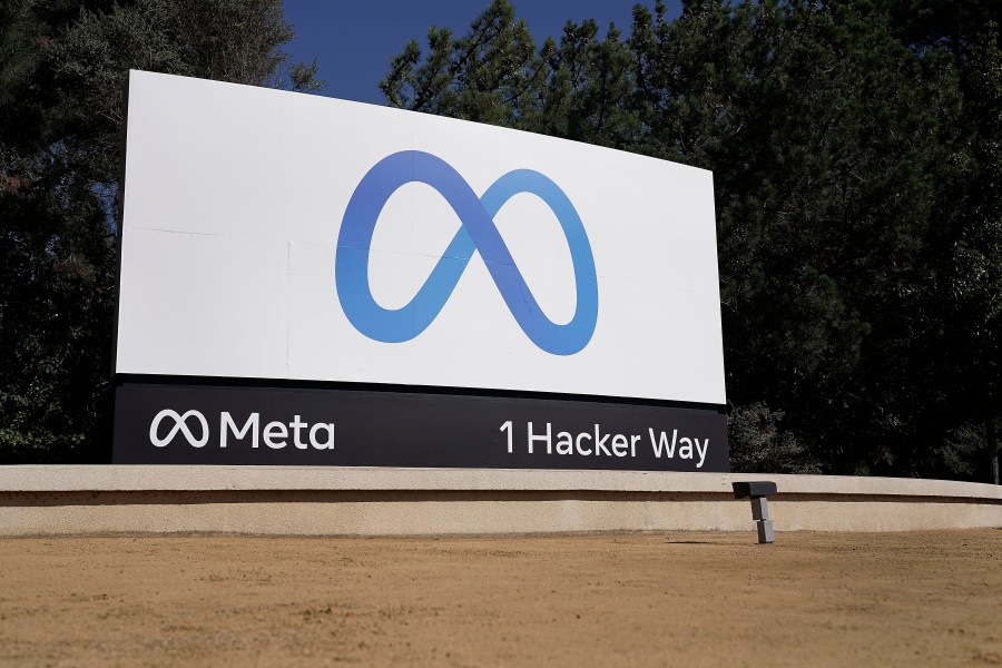 FILE - Facebook's Meta logo sign is seen at the company headquarters in Menlo Park, Calif., on, Oct. 28, 2021. Officials at Meta say they have found and disabled a network of thousands of fake Facebook accounts linked to China that were used to spread partisan content in the U.S. The accounts disclosed on Nov. 30, 2023, were designed to look like they were run by everyday Americans. (AP Photo/Tony Avelar, File)