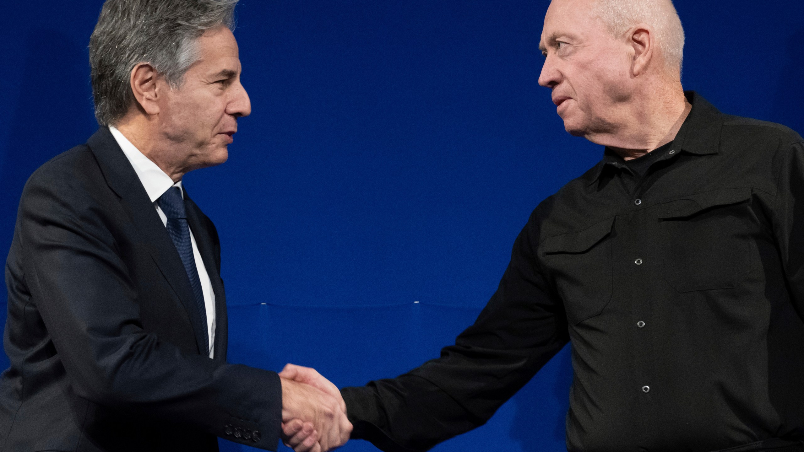 Israeli Defence Minister Yoav Gallant, right, and US Secretary of State Antony Blinken shake hands prior to a meeting in Tel Aviv, Israel, Thursday, Nov. 30, 2023. Blinken told Israeli leaders on November 30 that a temporary truce in their war with Hamas was "producing results" and should continue. (Saul Loeb/Pool Photo via AP)