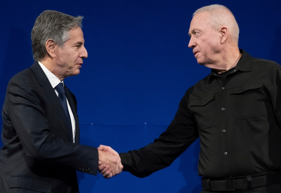 Israeli Defence Minister Yoav Gallant, right, and US Secretary of State Antony Blinken shake hands prior to a meeting in Tel Aviv, Israel, Thursday, Nov. 30, 2023. Blinken told Israeli leaders on November 30 that a temporary truce in their war with Hamas was "producing results" and should continue. (Saul Loeb/Pool Photo via AP)