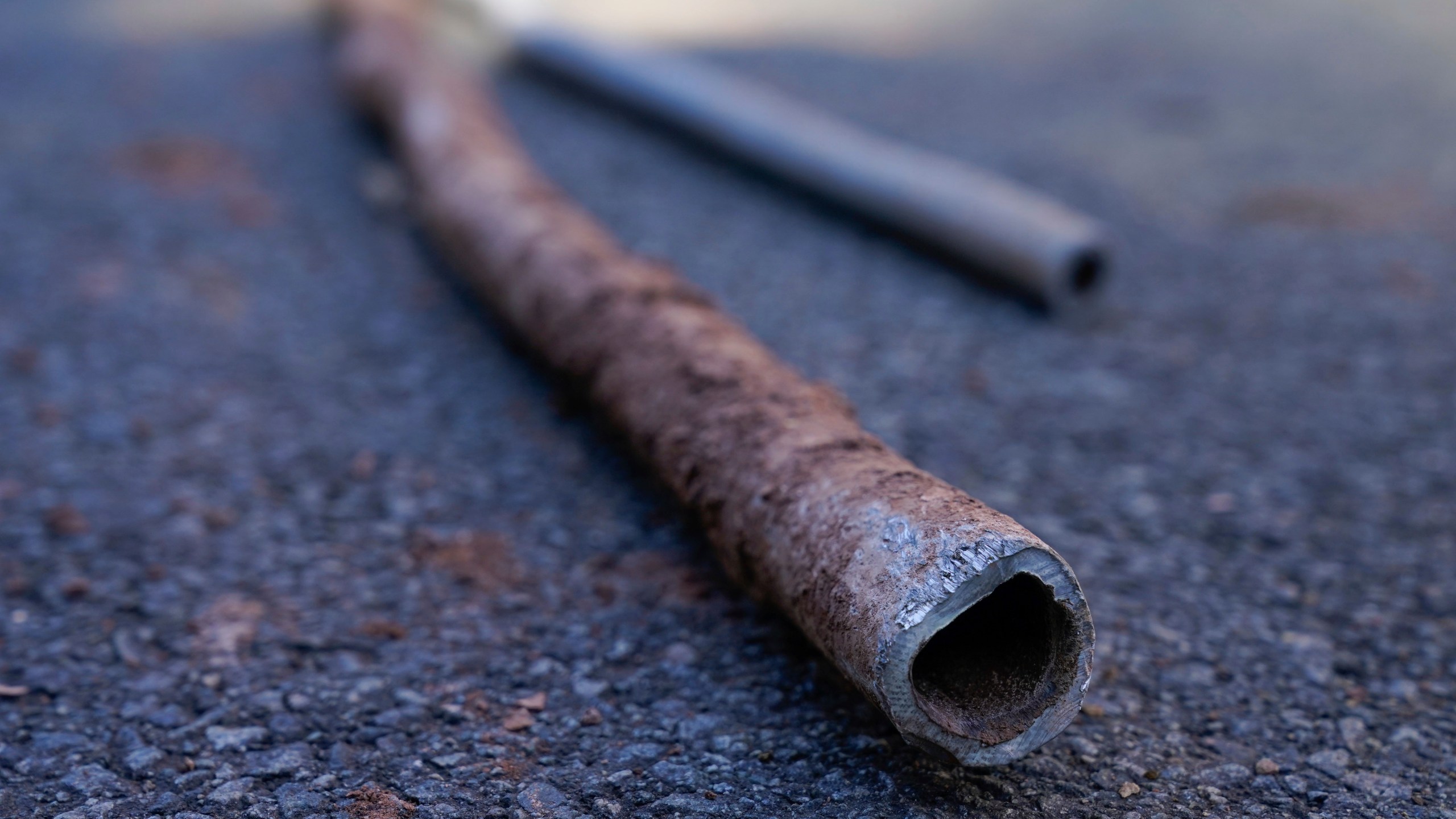 FILE - Lead water pipes pulled from underneath the street are seen in Newark, N.J., Oct. 21, 2021. (AP Photo/Seth Wenig, File)