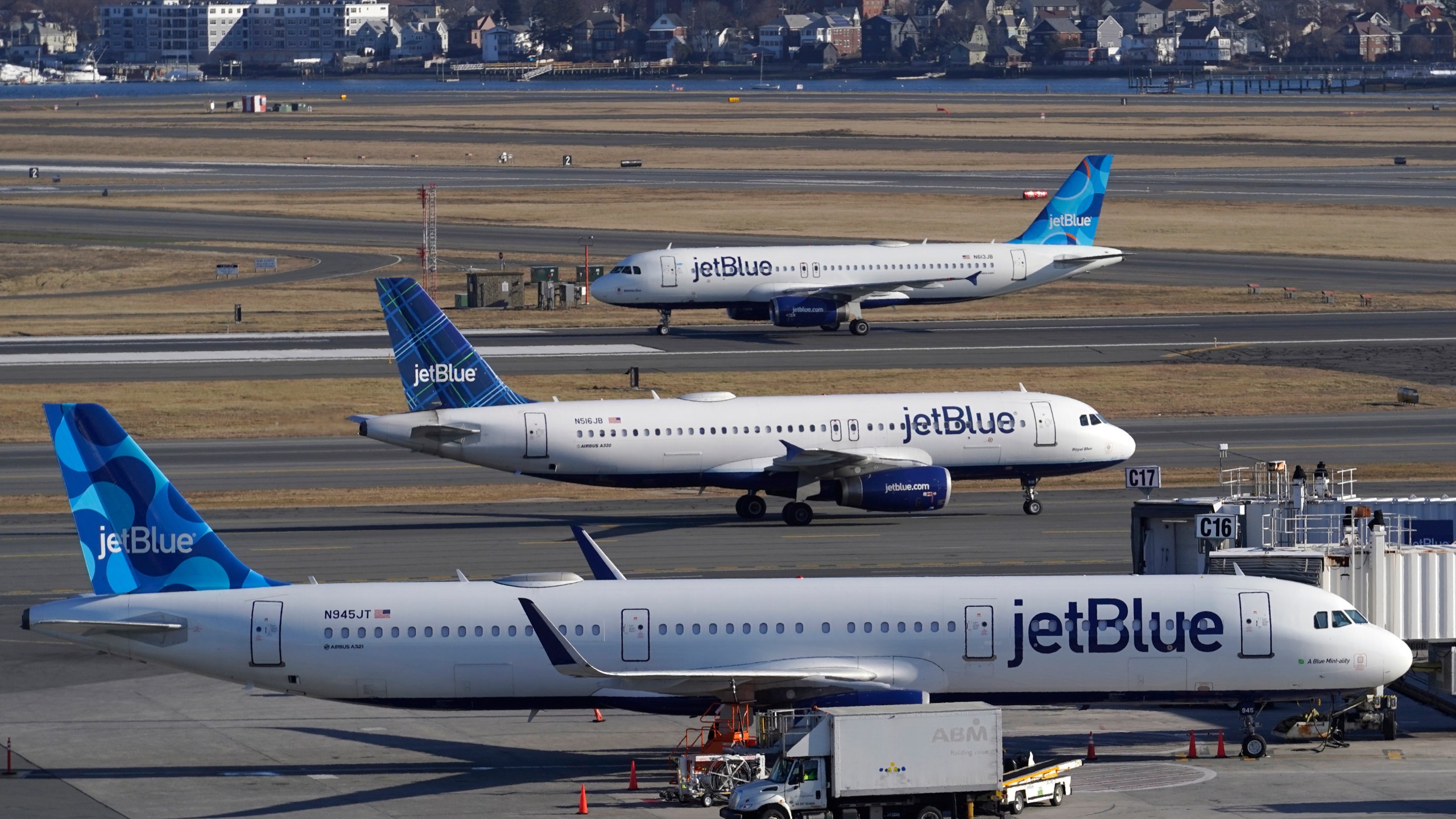 FILE - Passenger jets on the tarmac at Logan International Airport, Jan. 11, 2023, in Boston. The Federal Aviation Administration said Thursday, Nov. 30, 2023, they will propose requiring that new planes be capable of recording 25 hours of sounds in the cockpit, up from the current two hours, to prevent valuable information from being lost after close calls. (AP Photo/Steven Senne, File)