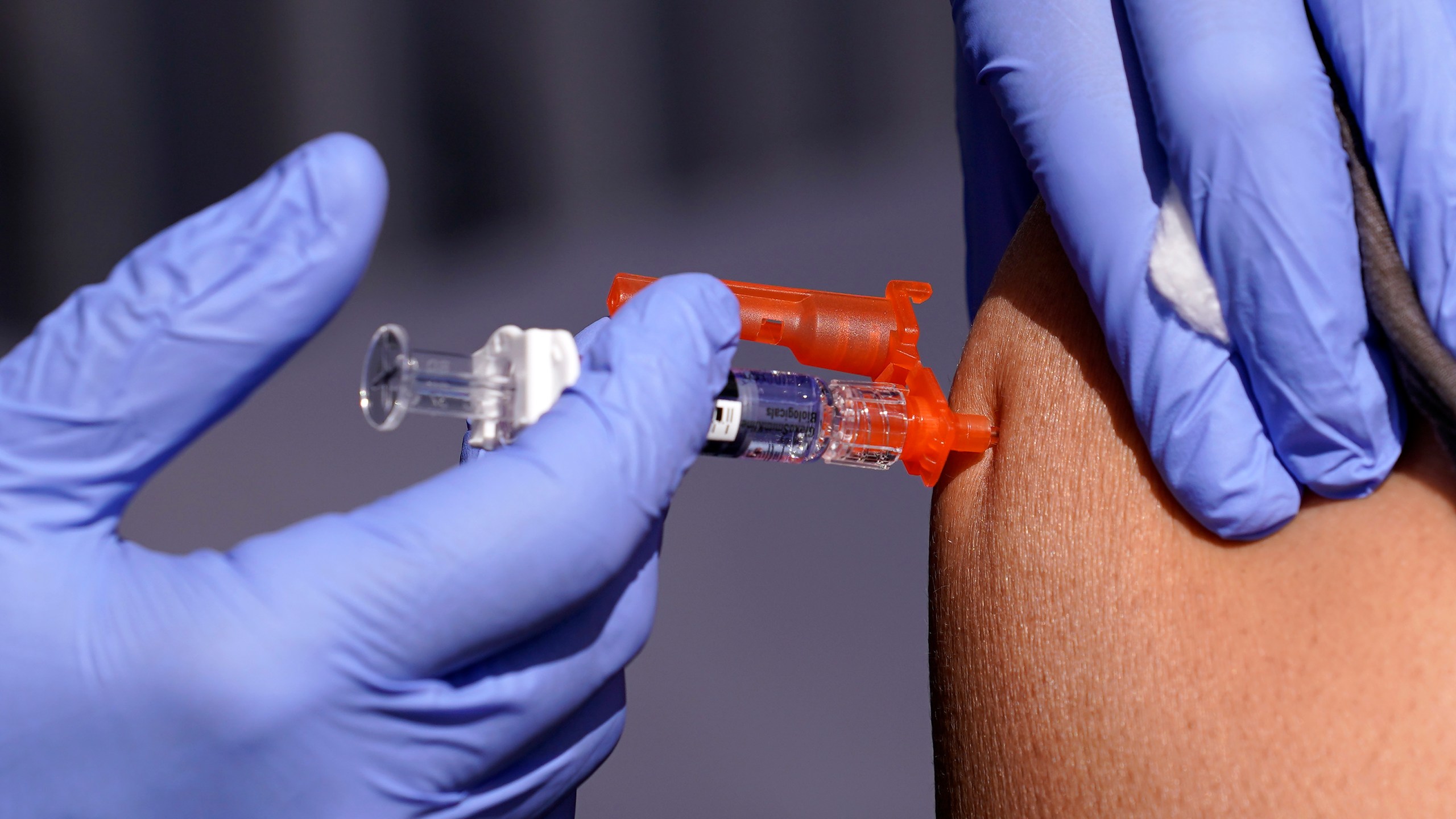 FILE - A patient is given a flu vaccine Friday, Oct. 28, 2022, in Lynwood, Calif. Seasonal flu continues to pick up steam in the U.S. But among respiratory viruses, COVID-19 remains the main cause of hospitalizations and deaths, health officials said Friday, Dec. 1, 2023. (AP Photo/Mark J. Terrill, File)