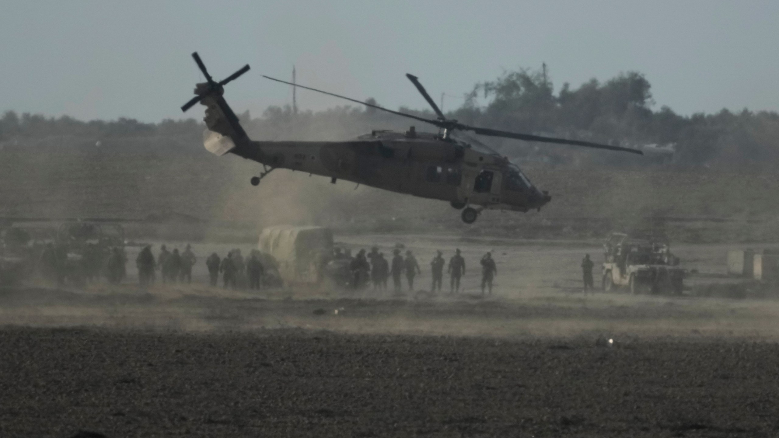 Israeli military helicopter lands near the Gaza Strip border on Saturday, Dec. 9, 2023. (AP Photo/Leo Correa)