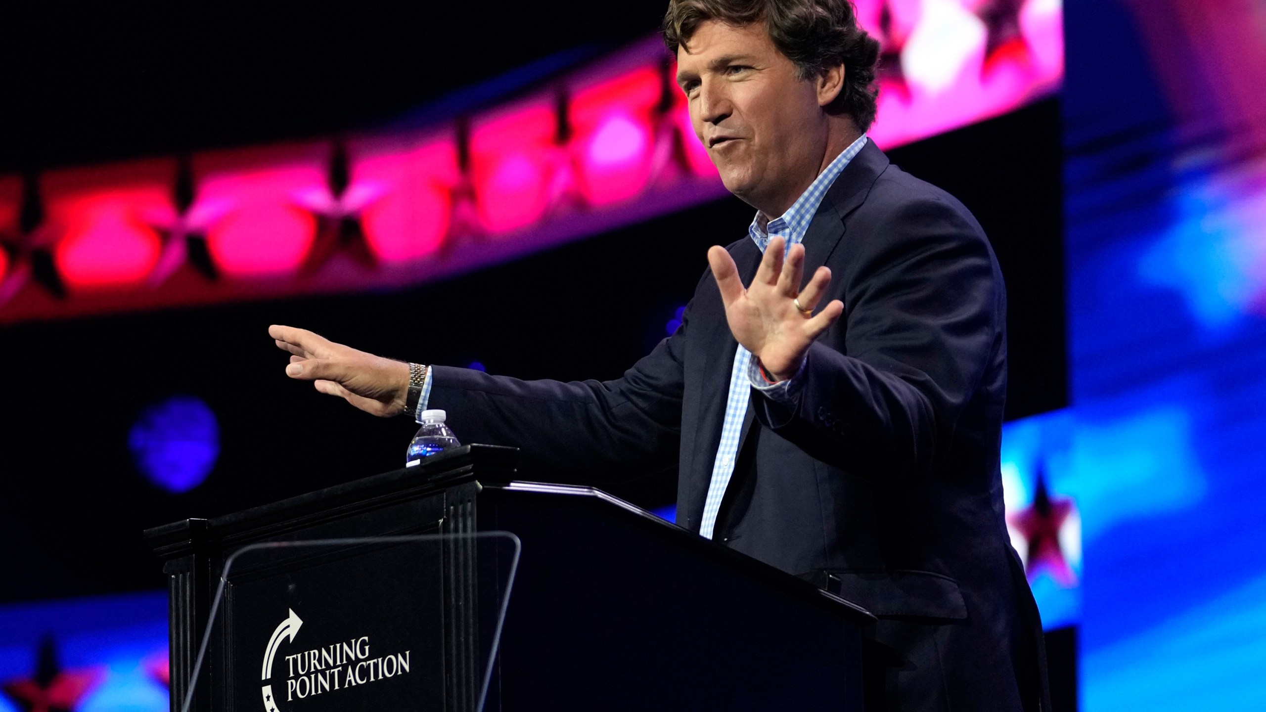 FILE - Tucker Carlson speaks at the Turning Point Action conference, Saturday, July 15, 2023, in West Palm Beach, Fla. Carlson, the ousted Fox News host, announced Monday, Dec. 11, that he is starting his own streaming service, promising to “tell the unadorned truth” to fans for $72 a year. (AP Photo/Lynne Sladky, File)