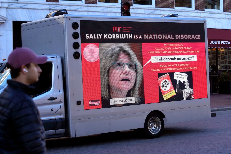 A truck with electronic panels drives along a street Tuesday, Dec. 12, 2023, near Harvard University, in Cambridge, Mass., while displaying messages calling attention to a recent controversy involving testimony to Congress by presidents of three prestigious schools, including Harvard University, MIT, and the University of Pennsylvania. Harvard President Claudine Gay will remain leader of Harvard following her comments last week at a congressional hearing on antisemitism, the university's highest governing body announced Tuesday. (AP Photo/Steven Senne)