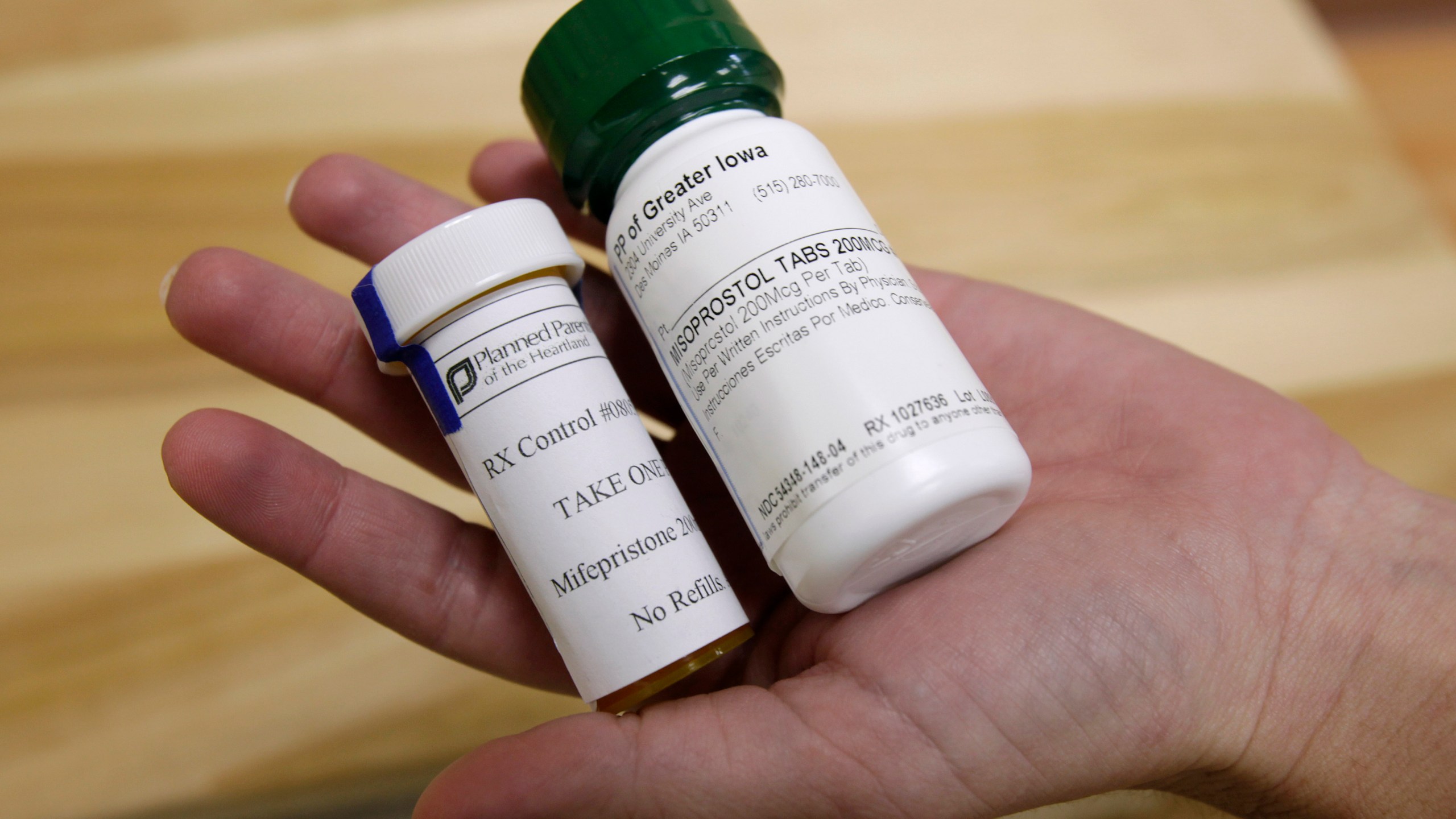 FILE - Bottles of abortion pills mifepristone, left, and misoprostol, right, at a clinic in Des Moines, Iowa, on Sept. 22, 2010. Medication abortion is the preferred method of ending pregnancy in the U.S., and one of the two drugs use — mifepristone — will now go in front of the U.S. Supreme Court in 2024. As states have imposed bans or restrictions or seek to limit abortions after Roe v. Wade was overturned in June 2022, demand for the abortion pills mifepristone and misoprostol have grown. (AP Photo/Charlie Neibergall, File)