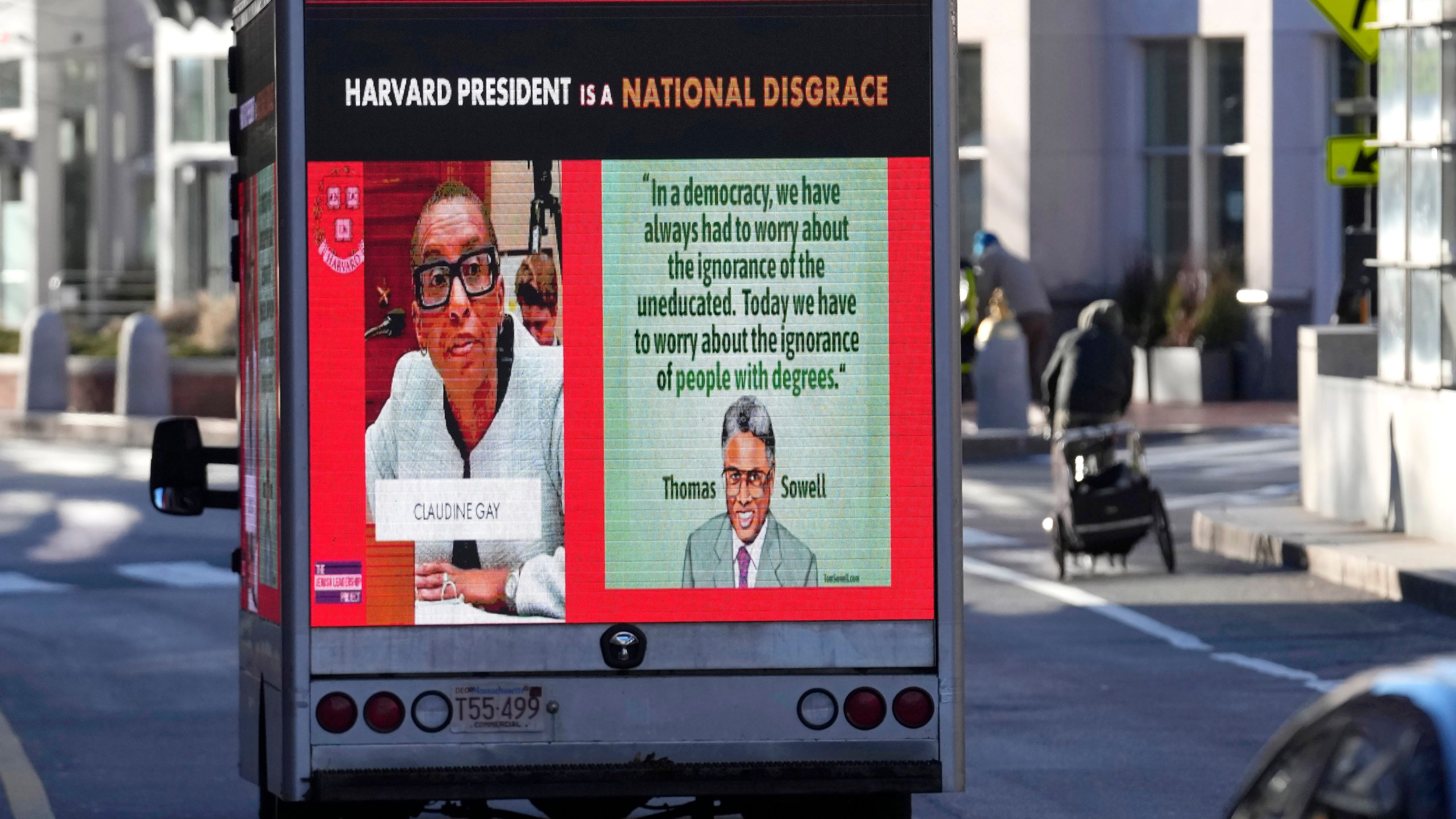 A truck with electronic panels drives along a street Tuesday, Dec. 12, 2023, near Harvard University, in Cambridge, Mass. The truck displays messages calling attention to a recent controversy involving testimony to Congress by presidents of three prestigious schools, including Harvard University, MIT, and the University of Pennsylvania. Harvard's highest governing body announced Tuesday that President Claudine Gay will remain leader of Harvard following her comments last week at a congressional hearing on antisemitism. (AP Photo/Steven Senne)