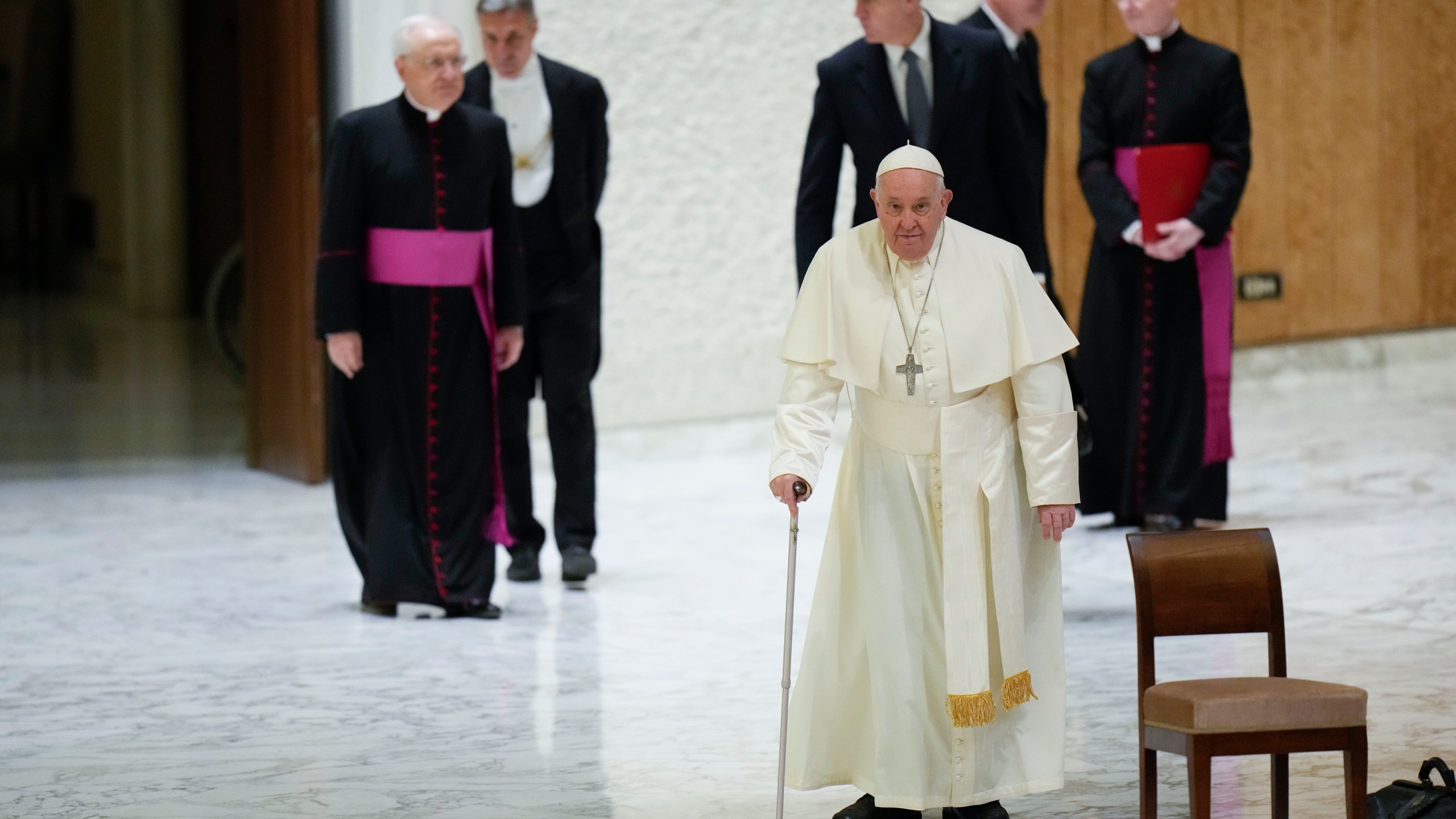 Pope Francis arrives for an audience with sick people and Lourdes pilgrimage operators in the Paul VI Hall, at the Vatican, Thursday, Dec. 14, 2023. (AP Photo/Alessandra Tarantino)