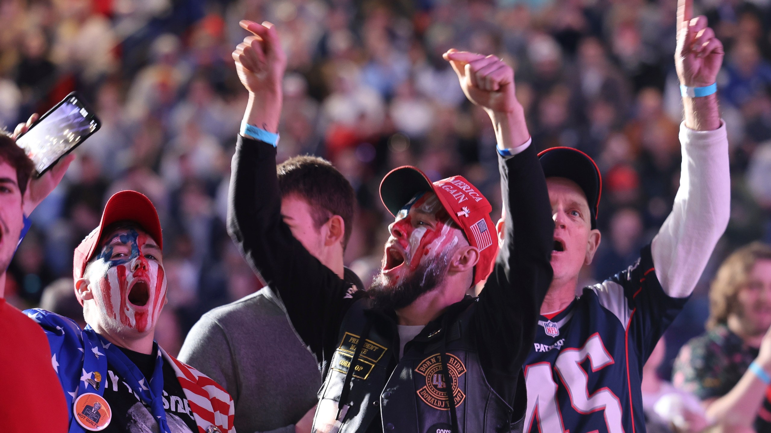 CAPTION CORRECTION CORRECTS DATE: Attendees cheer during a campaign rally for former president Donald Trump, Saturday, Dec. 16, 2023, in Durham, N.H. (AP Photo/Reba Saldanha)