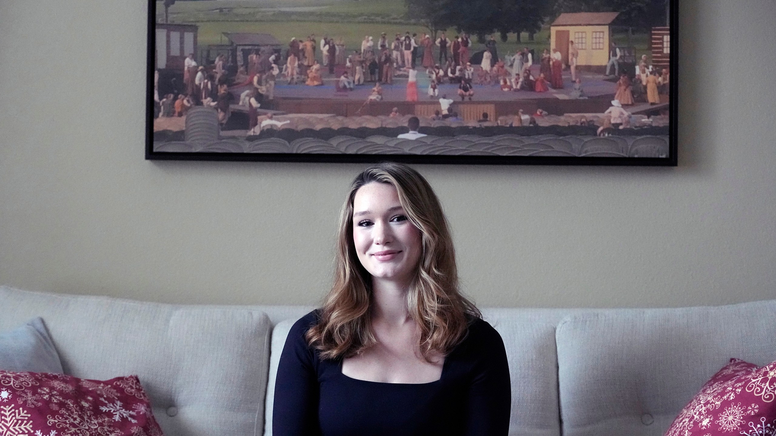 Nicole Plauché, 23, poses for a photo at her family's home in Highland Village, Texas, Friday, Dec. 15, 2023. Plauché graduated from college last year with a business degree and is navigating how to manage holiday spending while paying student loan debt. (AP Photo/LM Otero)