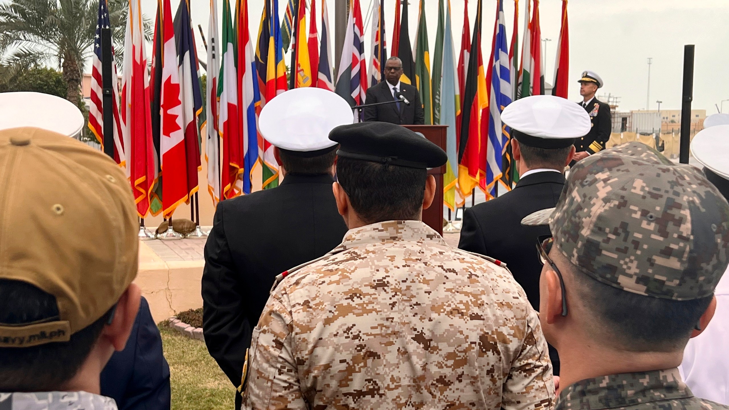 U.S. Defense Secretary Lloyd Austin, rear, addresses members of an international maritime task force protecting commercial ships in the Red Sea at U.S. Navy Central Command headquarters in Manama, Bahrain, Tuesday, Dec. 19, 2023. Due to a sharp increase in attacks on commercial vessels transiting there in the last few weeks the U.S. has announced a new mission, Operation Prosperity Guardian, to get additional countries to send ships and intelligence support. (AP Photo/Tara Copp)