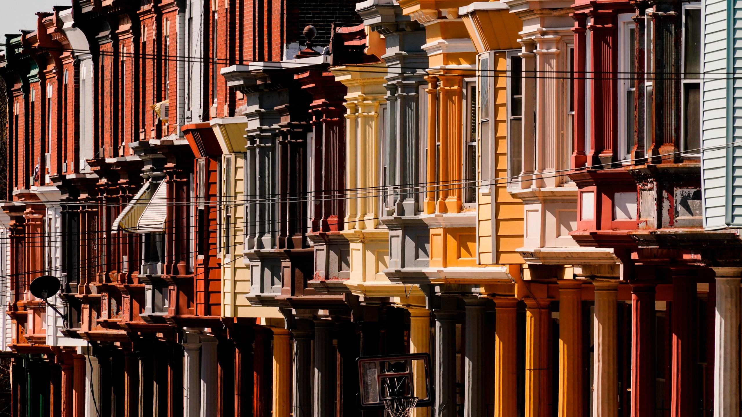 File - Row houses in Philadelphia are shown on April 8, 2022. In 2023, higher interest rates left their mark in the U.S. housing market. Sales of previously occupied U.S. homes slumped in October to their slowest pace in more than 13 years. (AP Photo/Matt Rourke, File)