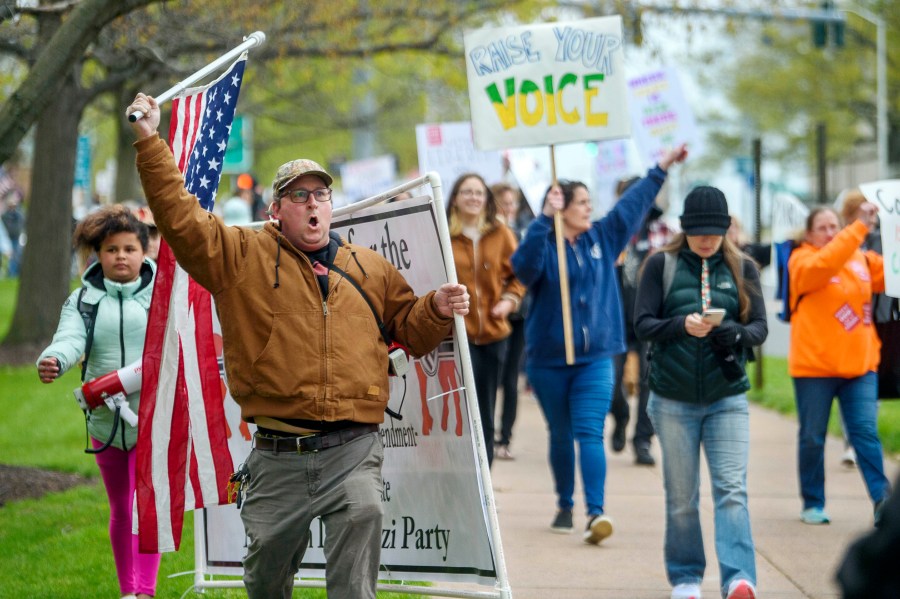 FILE - Opponents of a bill to repeal Connecticut's religious exemption for required school vaccinations march down Capitol Avenue before the State Senate voted on legislation on April 27, 2021, in Hartford, Conn. Connecticut eliminated its longstanding religious waiver for vaccinations in 2021, joining California, West Virginia, New York and Maine in allowing only medical exemptions. (Mark Mirko/Hartford Courant via AP, File)