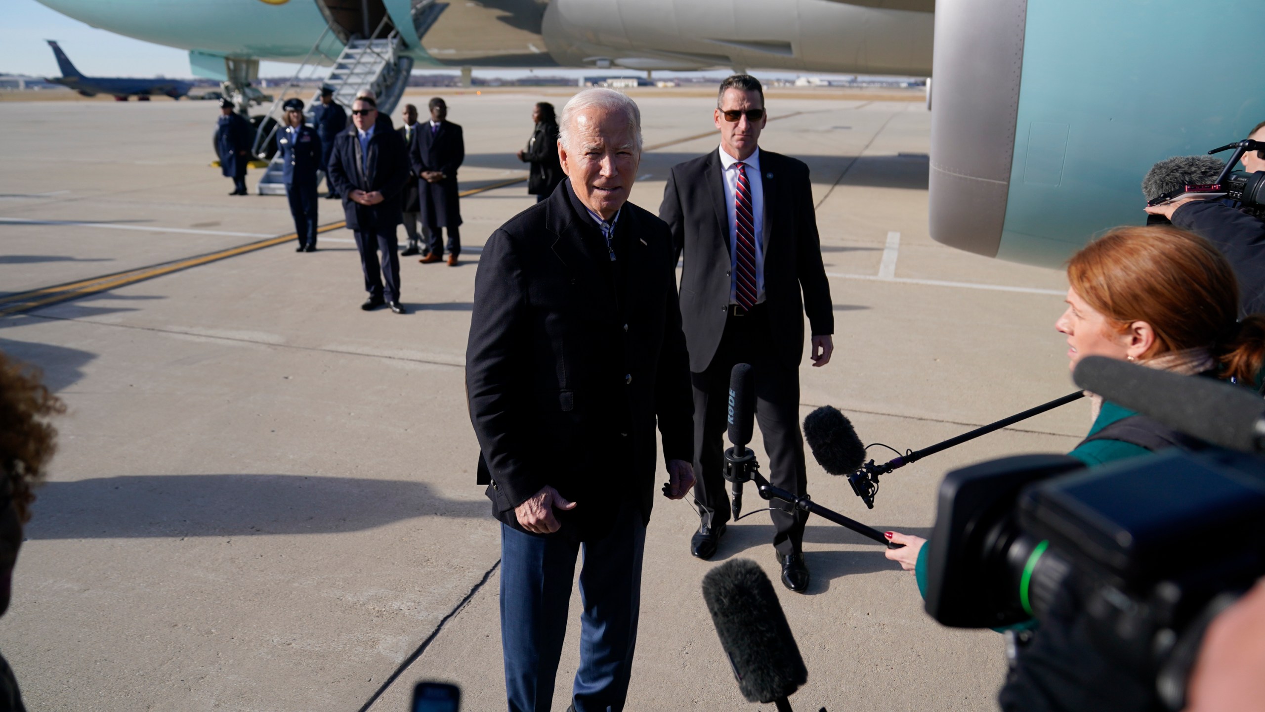 President Joe Biden speaks to members of the media as he arrives at Milwaukee Mitchell International Airport, Wednesday, Dec. 20, 2023, in Milwaukee. (AP Photo/Evan Vucci)