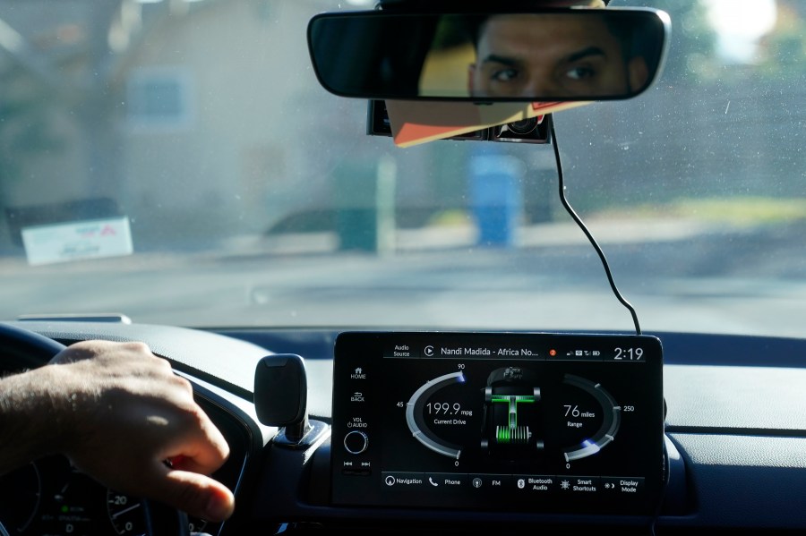 Power Flow information is displayed on the screen of a 2024 Honda CR-V Hybrid as Shalinder Singh drives while being interviewed in Sunnyvale, Calif., Monday, Dec. 11, 2023. Like many hybrid buyers, Singh, an Uber driver, said that for him, the gas savings helped tip the price equation in favor of a Honda CR-V hybrid over the corresponding gasoline model. (AP Photo/Jeff Chiu)