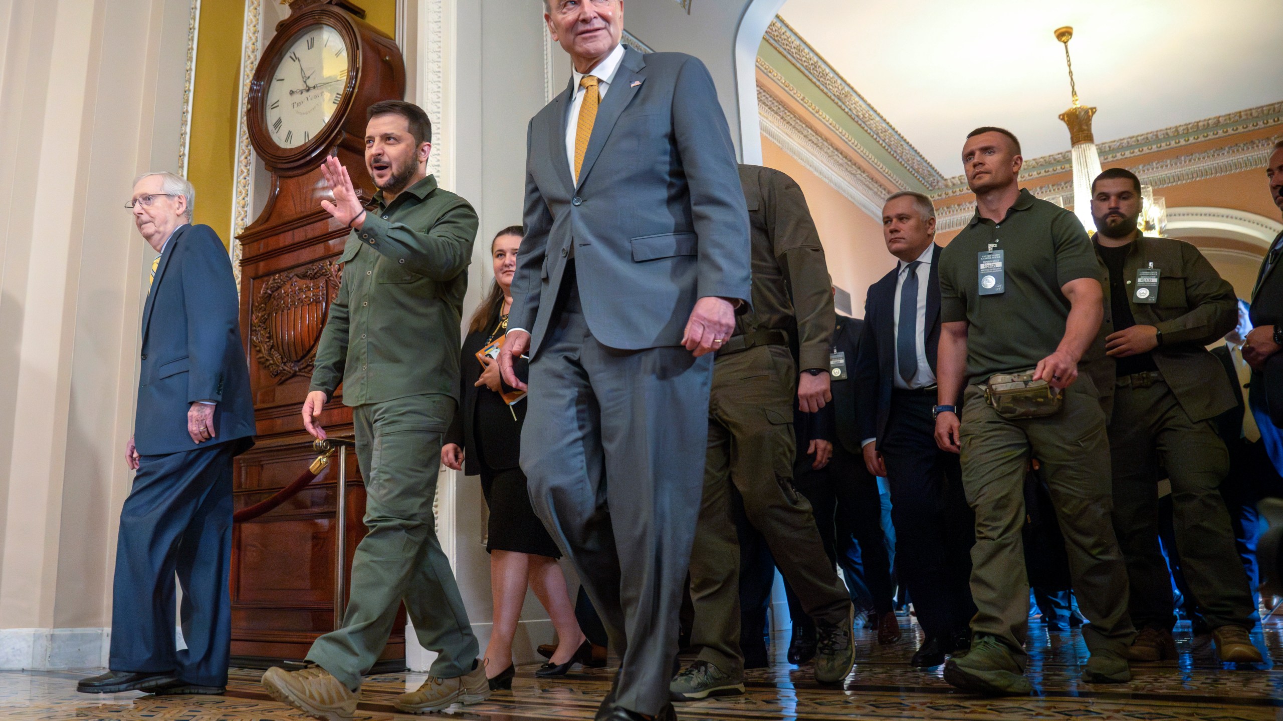 FILE - Ukrainian President Volodymyr Zelenskyy, second from left, walks with Senate Minority Leader Mitch McConnell of Ky., left, and Senate Majority Leader Chuck Schumer of N.Y., right, at Capitol Hill on Thursday, Sept. 21, 2023, in Washington. Congress broke for the holidays, not expected to return for two weeks while continued aid for Ukraine has nearly been exhausted. (AP Photo/Mark Schiefelbein, File)