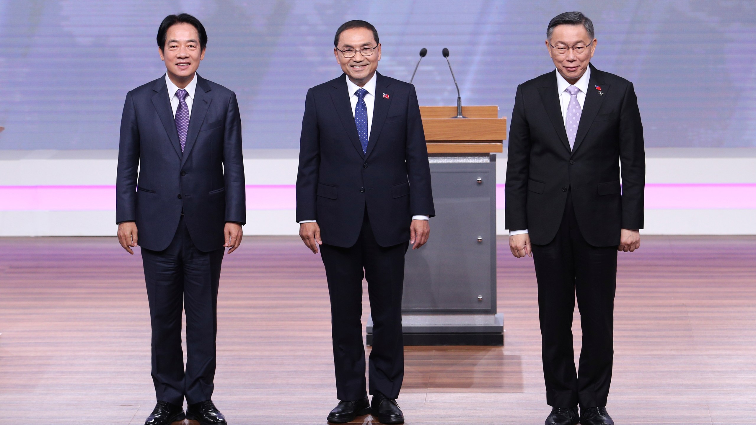 Taiwan President and Democratic Progressive Party presidential candidate William Lai, from left, Taiwan's Nationalist Party presidential candidate Hou Yu-ih and Taiwan's Taiwan People's Party (TPP) presidential candidate Ko Wen-je pose before the presidential debates at Taiwan Public Television Service in Taipei, Taiwan, Saturday, Dec. 30, 2023. Taiwan will hold its presidential election on Jan. 13, 2024. (AP Photo/Pei Chen, Pool)