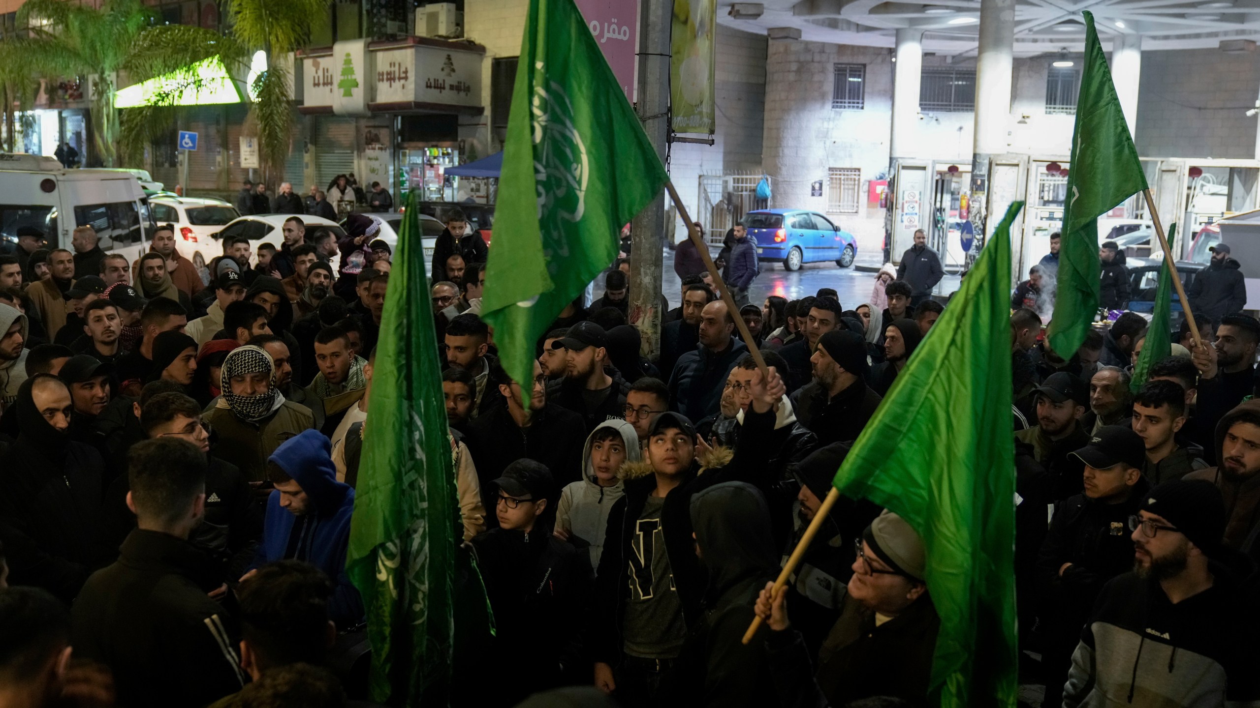 Palestinian demonstrators wave Hamas flags and shout slogans during a protest following the killing of top Hamas official Saleh Arouri in Beirut, in the West Bank city of Nablus on Tuesday, Jan. 2, 2024. Arouri, the No. 2 figure in Hamas, was killed in an explosion blamed on Israel. He is the highest-ranked Hamas figure to be killed in the nearly three-month war between Israel and Hamas. (AP Photo/Majdi Mohammed)