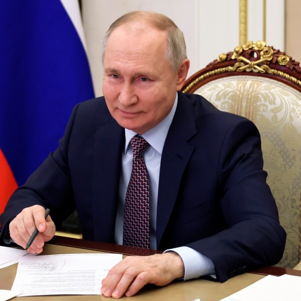 FILE - Russian President Vladimir Putin takes part in the opening ceremony of the Vostok (East) M-12 motorway to Kazan, via videoconference, in Moscow, Russia, Thursday, Dec. 21, 2023. Putin on Thursday, Jan. 4, 2024 signed a decree allowing for a quicker path to Russian citizenship for foreigners who enlist in the country's army amid the special military operation in Ukraine. (Mikhail Klimentyev, Sputnik, Kremlin Pool Photo via AP, File)