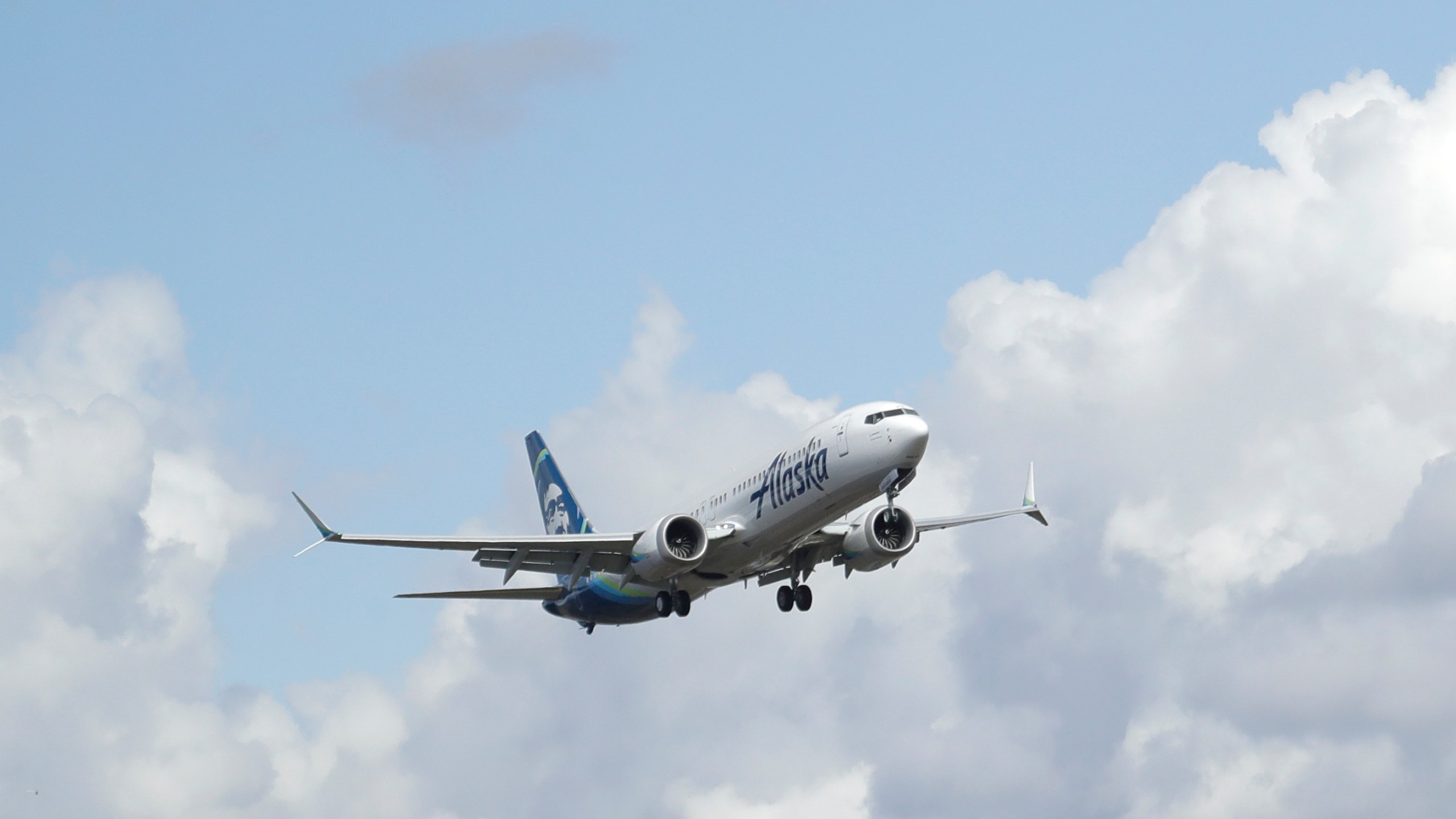 FILE - An Alaska Airlines Boeing 737-9 Max flies above Paine Field near Boeing's manufacturing facility in Everett, Wash., Monday, March 23, 2020, north of Seattle. A window panel blew out on a similar Alaska Airlines Boeing 737-9 Max seven minutes after takeoff from Portland, Ore., on Friday, Jan. 5, 2023. (AP Photo/Ted S. Warren, File)