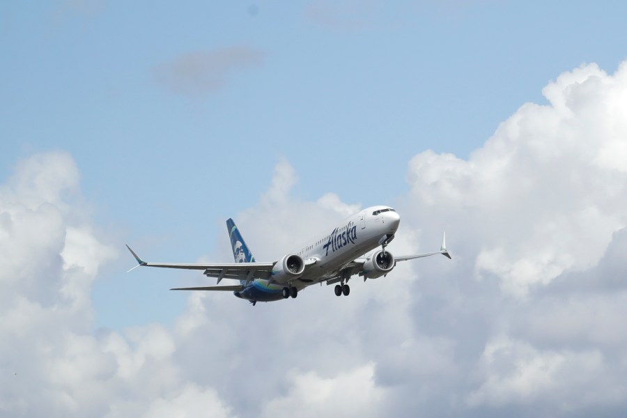 FILE - An Alaska Airlines Boeing 737-9 Max flies above Paine Field near Boeing's manufacturing facility in Everett, Wash., Monday, March 23, 2020, north of Seattle. A window panel blew out on a similar Alaska Airlines Boeing 737-9 Max seven minutes after takeoff from Portland, Ore., on Friday, Jan. 5, 2023. (AP Photo/Ted S. Warren, File)