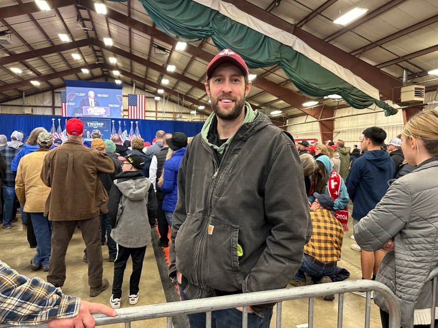 William Caspers, a 37-year-old farmer from Rockwell, Iowa, attends a rally for Donald Trump in Mason City, Iowa, on Friday, Jan. 5, 2024. Caspers says he's supporting Trump "100%" in 2024 but wasn't sure where or when to caucus for him. Though Trump is the favorite to win the Iowa Republican caucuses, some of his supporters aren't well-versed on the complexities of the process and his campaign has scaled back its door-knocking, get-out-the-vote operation in favor of other techniques to motivate supporters. (AP Photo/Steve Peoples)