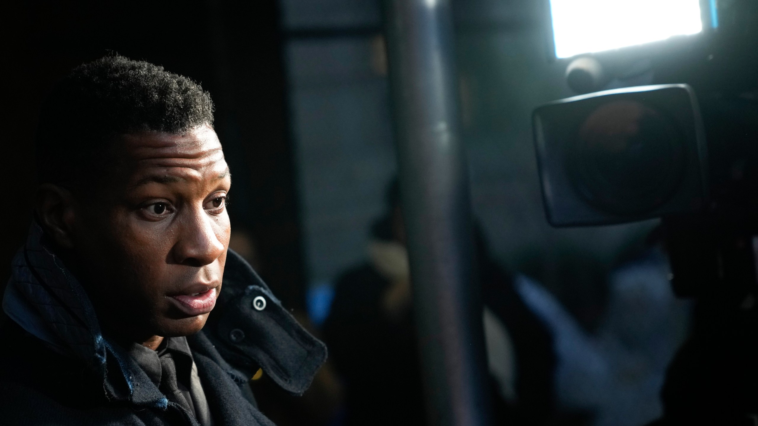 FILE - Jonathan Majors leaves the Manhattan criminal courthouse in New York, Dec. 18, 2023. In his first interview since his assault and harassment conviction last month, Majors says he was shocked by the New York jury’s verdict, Monday, Jan. 8, 2024. (AP Photo/Seth Wenig, file)