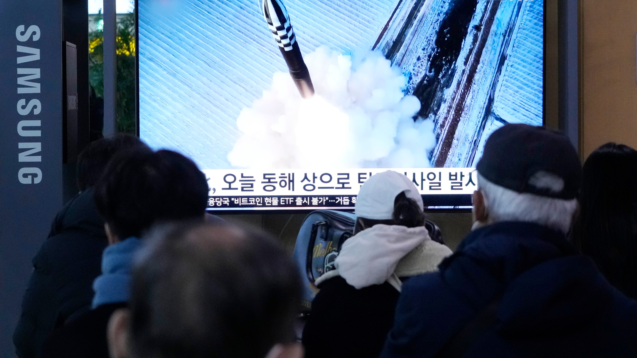 A TV screen shows a file image of North Korea's missile launch during a news program at the Seoul Railway Station in Seoul, South Korea, Sunday, Jan. 14, 2024. North Korea fired a ballistic missile toward the sea on Sunday, its neighbors said, in its first missile launch this year, as the North is expected to further raise regional animosities in an election year for its rivals South Korea and the United States. (AP Photo/Ahn Young-joon)