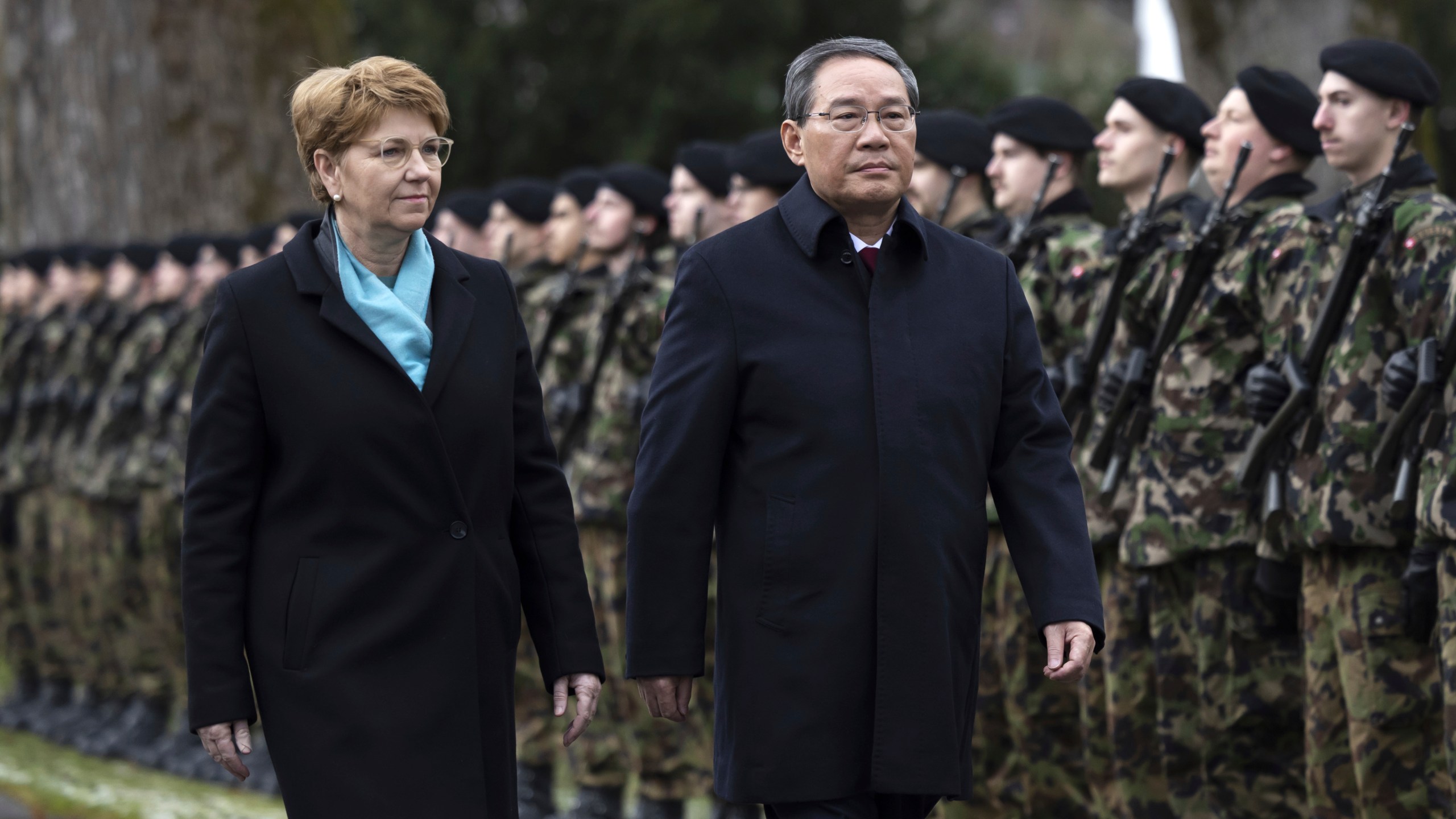 Swiss President Viola Amherd, left, and Chinese Prime Minister Li Qiang inspect the guard of honour in Kehrsatz, near Bern, Switzerland, Monday, Jan. 15, 2024. Chinese Prime Minister Li Qiang is visiting Switzerland to attend the World Economic Forum in Davos. (Peter Klaunzer/Keystone via AP)