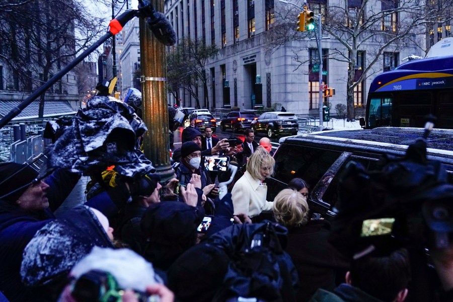 E. Jean Carroll, center, leaves Manhattan federal court following her defamation trial against former President Donald Trump, Tuesday, Jan. 16, 2024, in New York. (AP Photo/Frank Franklin II)