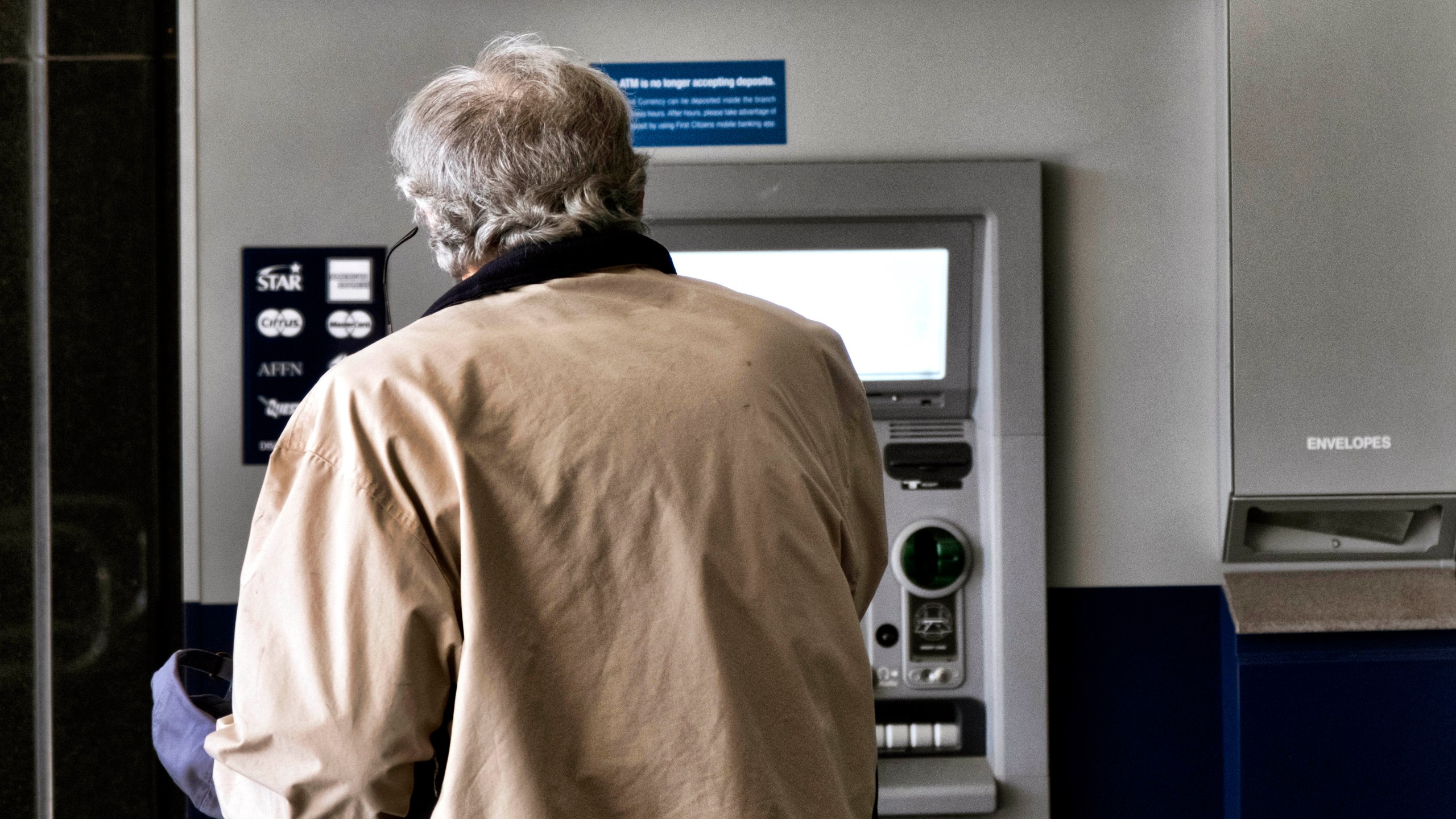 File - A customer makes a transaction at an automatic teller machine in Los Angeles on March 27, 2023. The cost to overdraw a bank account could drop to as little as $3 under a proposal announced by the White House, the latest move by the Biden administration to combat fees it says pose an unnecessary burden on American consumers, particularly those living paycheck to paycheck. (AP Photo/Richard Vogel, File)