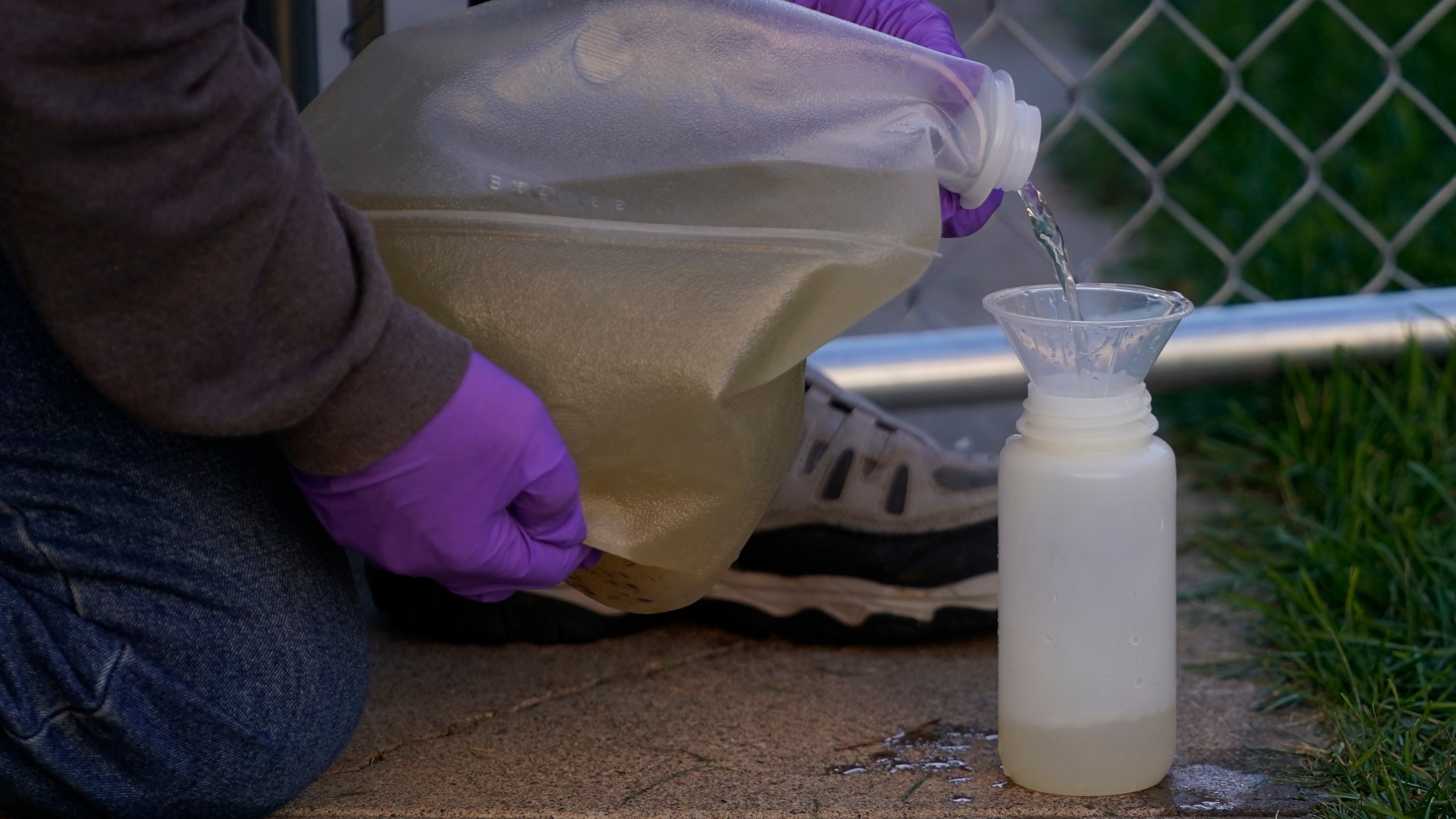 FILE - A professor collects sewage samples from a dorm at Utah State University Wednesday, Sept. 2, 2020, in Logan, Utah., to monitor wastewater in hopes of stopping coronavirus outbreaks before they get out of hand. According to a report by the U.S. Centers for Disease Control and Prevention released Thursday, Jan. 18, 2024, wastewater testing does a good job at detecting mpox infections, bolstering a push to use sewage to track more and more diseases. (AP Photo/Rick Bowmer, File)