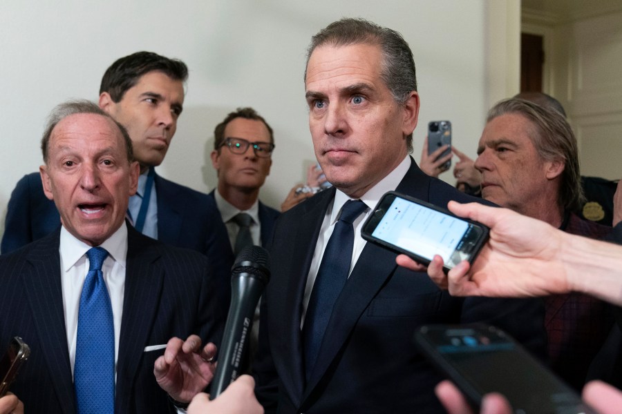 Hunter Biden, President Joe Biden's son, accompanied by his attorney Abbe Lowell, left, talks to reporters as they leave a House Oversight Committee hearing as Republicans are taking the first step toward holding him in contempt of Congress, Wednesday, Jan. 10, 2024, on Capitol Hill in Washington. (AP Photo/Jose Luis Magana)