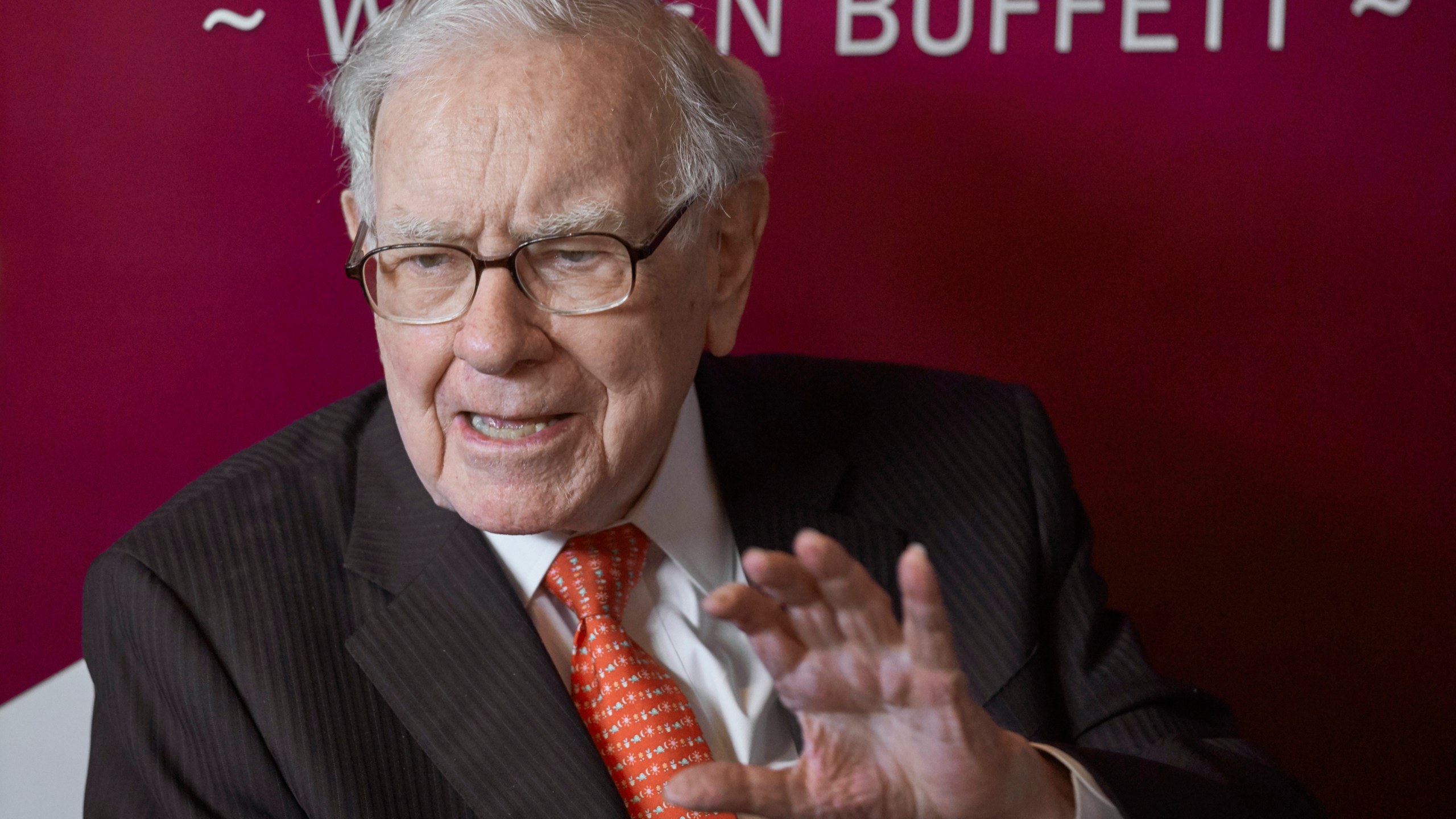 FILE - Warren Buffett, Chairman and CEO of Berkshire Hathaway, speaks during a game of bridge after the annual Berkshire Hathaway shareholders meeting in Omaha, Neb., on May 5, 2019. A recent report from anti-poverty organization Oxfam highlighted how the fortunes of the world's five richest people — Tesla CEO Elon Musk, Bernard Arnault of luxury company LVMH, Amazon founder Jeff Bezos, Oracle founder Larry Ellison and investment guru Buffett — have more than doubled since 2020. (AP Photo/Nati Harnik, File)