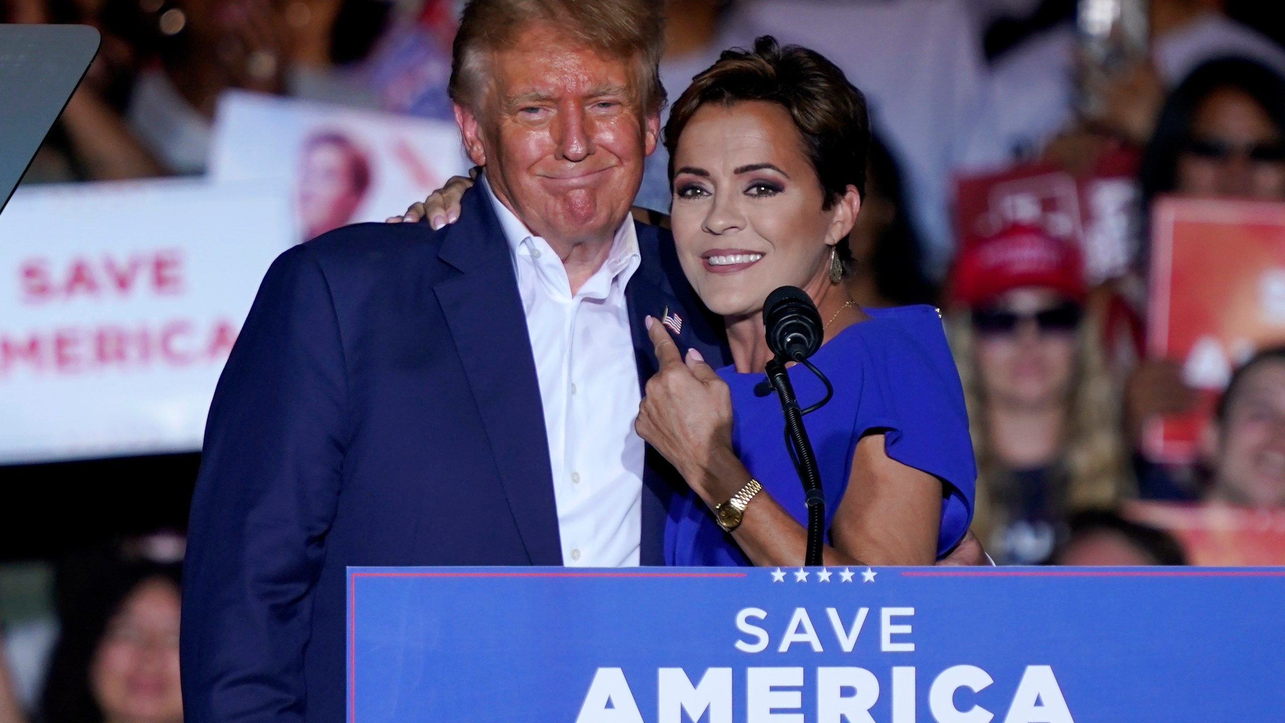 FILE - Arizona Republican gubernatorial candidate Kari Lake, right, speaks as former President Donald Trump listens during a rally, Oct. 9, 2022, in Mesa, Ariz. While vice presidential candidates typically aren't tapped until after a candidate has locked down the nomination, Trump's decisive win in the Iowa caucuses and the departure of Florida Gov. Ron DeSantis from the race has only heightened what had already been a widespread sense of inevitability. Lake is considered a close ally of the former president who is among those being considered for the job. (AP Photo/Matt York, File)