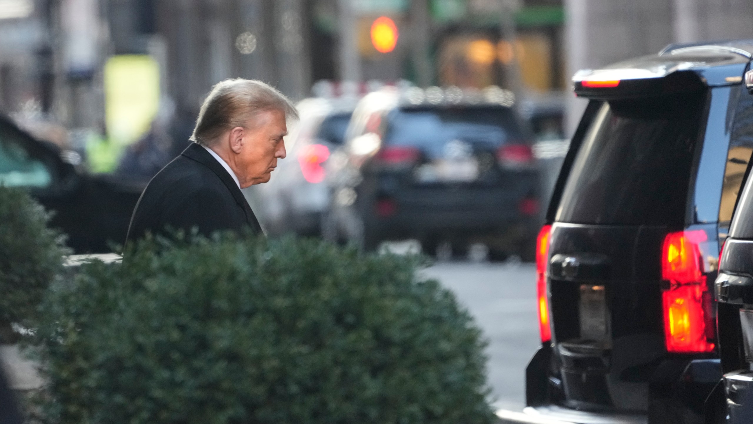 Former President Donald Trump leaves his apartment building in New York, Monday, Jan. 22, 2024. (AP Photo/Seth Wenig)