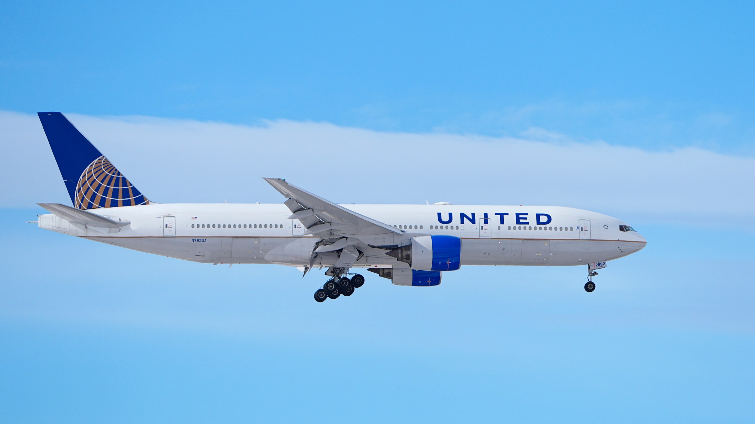 A United Airlines jetliner heads in for a landing at Denver International Airport after a winter storm swept through the region Tuesday, Jan. 16, 2024, in Denver. Forecasters predict that the frigid weather will persist until midweek in the intermountain West. (AP Photo/David Zalubowski)