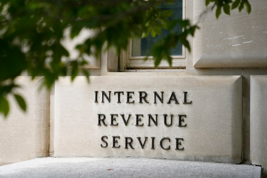 FILE - A sign outside the Internal Revenue Service building is seen, May 4, 2021, in Washington. The IRS wants to rewrite its complicated letters to taxpayers and speak to people in plain English. The IRS is rewriting and sending out commonly received notices ahead of the 2024 tax filing season as part of its new "Simple Notice Initiative." Treasury Secretary Janet Yellen said Tuesday, Jan. 23, 2024, "Redesigned notices will be shorter, clearer and easier to understand." (AP Photo/Patrick Semansky, File)