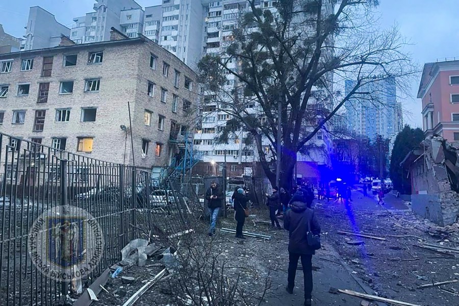 In this photo provided by the Kyiv Regional Military Administration, debris of a destroyed apartment building is seen after a Russian attack in Kyiv, Ukraine, Tuesday, Jan. 23, 2024. (Kyiv Regional Military Administration via AP)