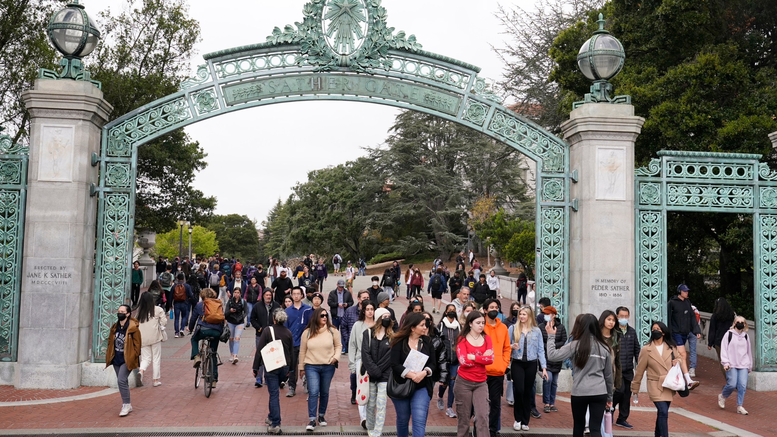 File - Students make their way through the Sather Gate near Sproul Plaza on the University of California, Berkeley, campus March 29, 2022, in Berkeley, Calif. The Free Application for Federal Student Aid is available for the 2024-2025 school year, three months later than usual. (AP Photo/Eric Risberg, File)