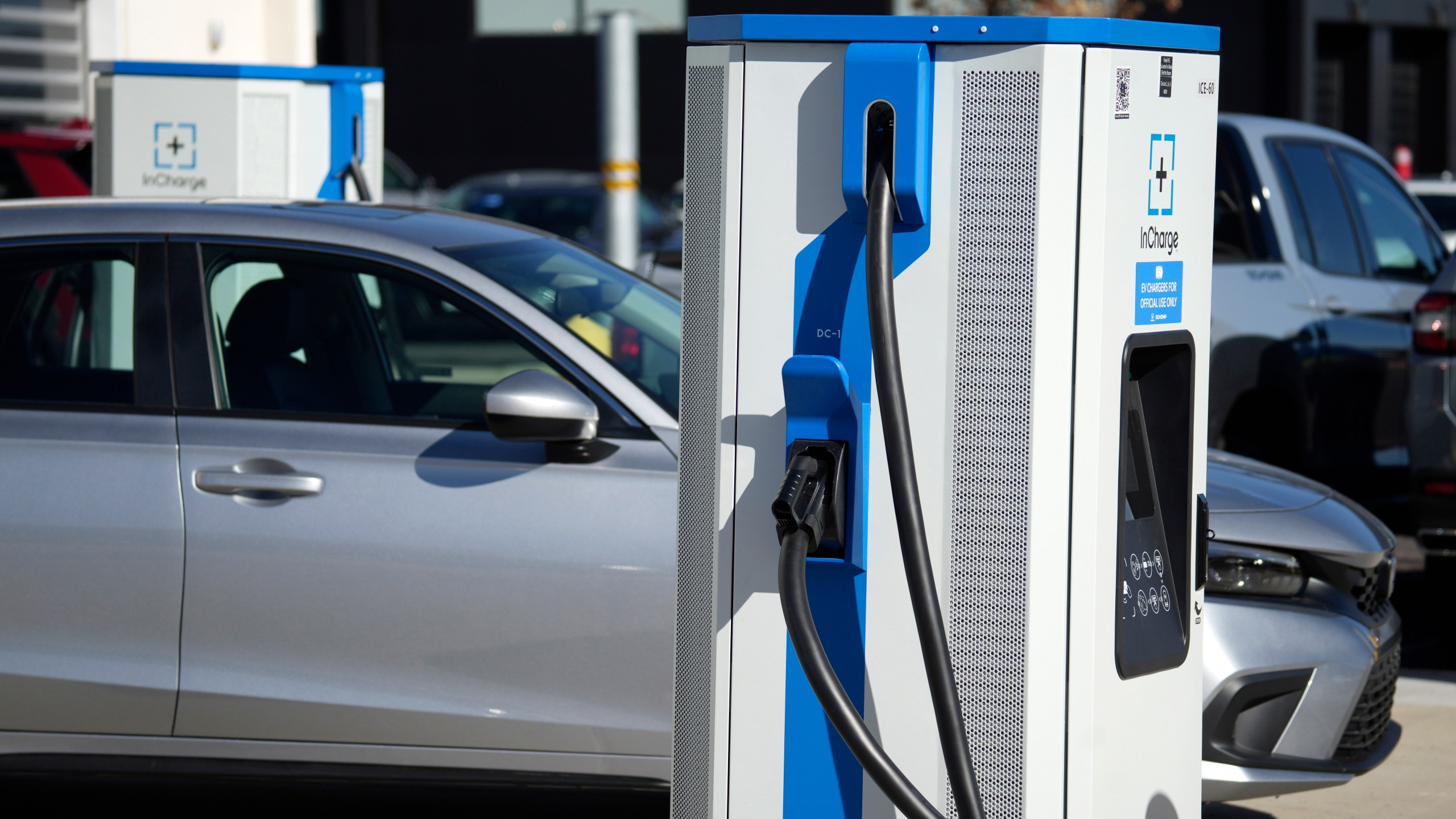 FILE - A charging station outside a Honda dealership on Nov. 12, 2023, in Highlands Ranch, Colo. The Biden administration is awarding $623 million in grants to help build an electric vehicle charging network across the nation. Grants being announced Thursday will fund 47 EV charging stations and related projects in 22 states and Puerto Rico, including 7,500 EV charging ports. (AP Photo/David Zalubowski, File)