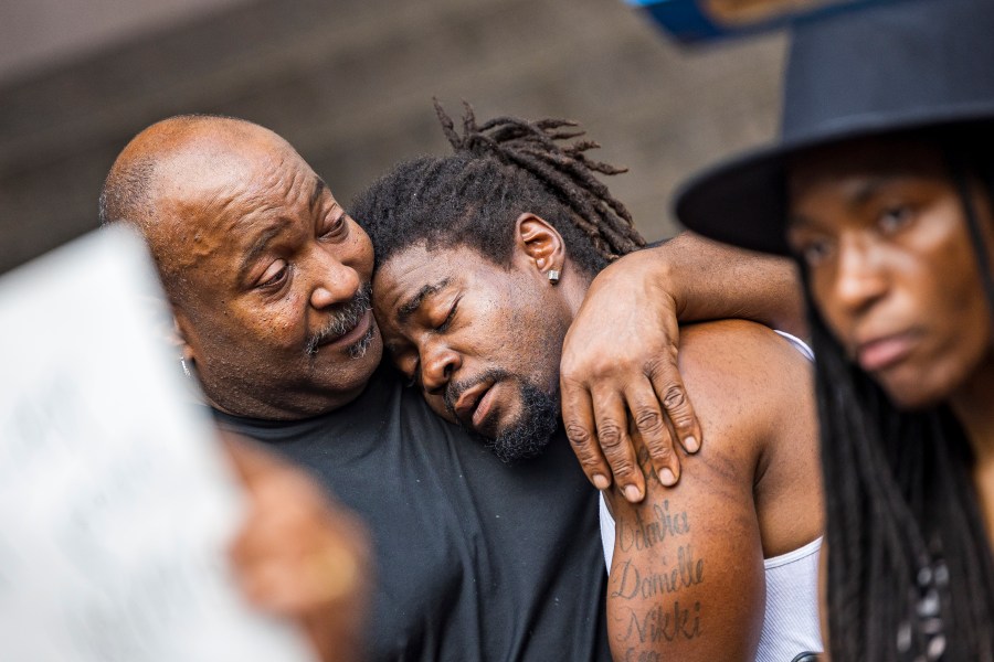 Rashad Cobb, Ricky Cobb II's twin brother, leans on the shoulders of relatives during a news conference outside the Hennepin County Government Center on Aug. 2, 2023, in Minneapolis. A Minnesota State Patrol trooper has been charged with murder in the shooting of motorist Ricky Cobb II after he failed to get out of his car during a July traffic stop. Trooper Ryan Londregan was charged with second-degree unintentional murder, first-degree assault and second degree manslaughter in the death of Cobb, a 33-year-old Black man. Hennepin County Attorney Mary Moriarty announced the charges at a news conference on Wednesday, Jan. 24, 2024. (Kerem Yücel/Minnesota Public Radio via AP)