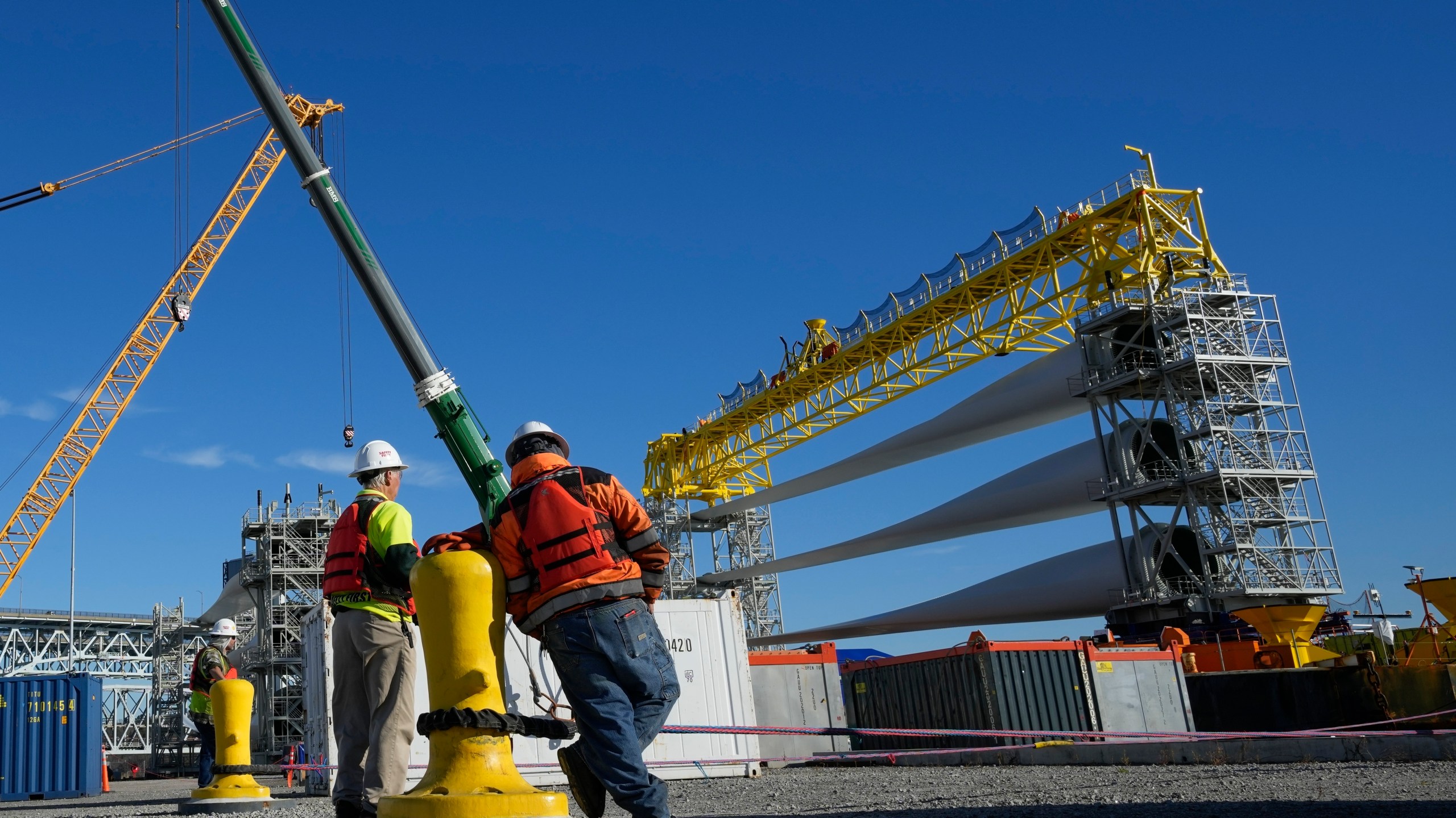 File - A generator and its blades are prepared to head to the open ocean for the South Fork Wind farm from State Pier in New London, Conn., Dec. 4, 2023. On Thursday, the government issues the first of three estimates of GDP growth in the United States during the October-December quarter.(AP Photo/Seth Wenig, File)