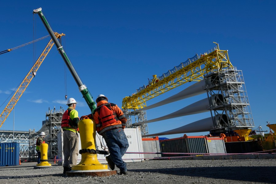 File - A generator and its blades are prepared to head to the open ocean for the South Fork Wind farm from State Pier in New London, Conn., Dec. 4, 2023. On Thursday, the government issues the first of three estimates of GDP growth in the United States during the October-December quarter.(AP Photo/Seth Wenig, File)