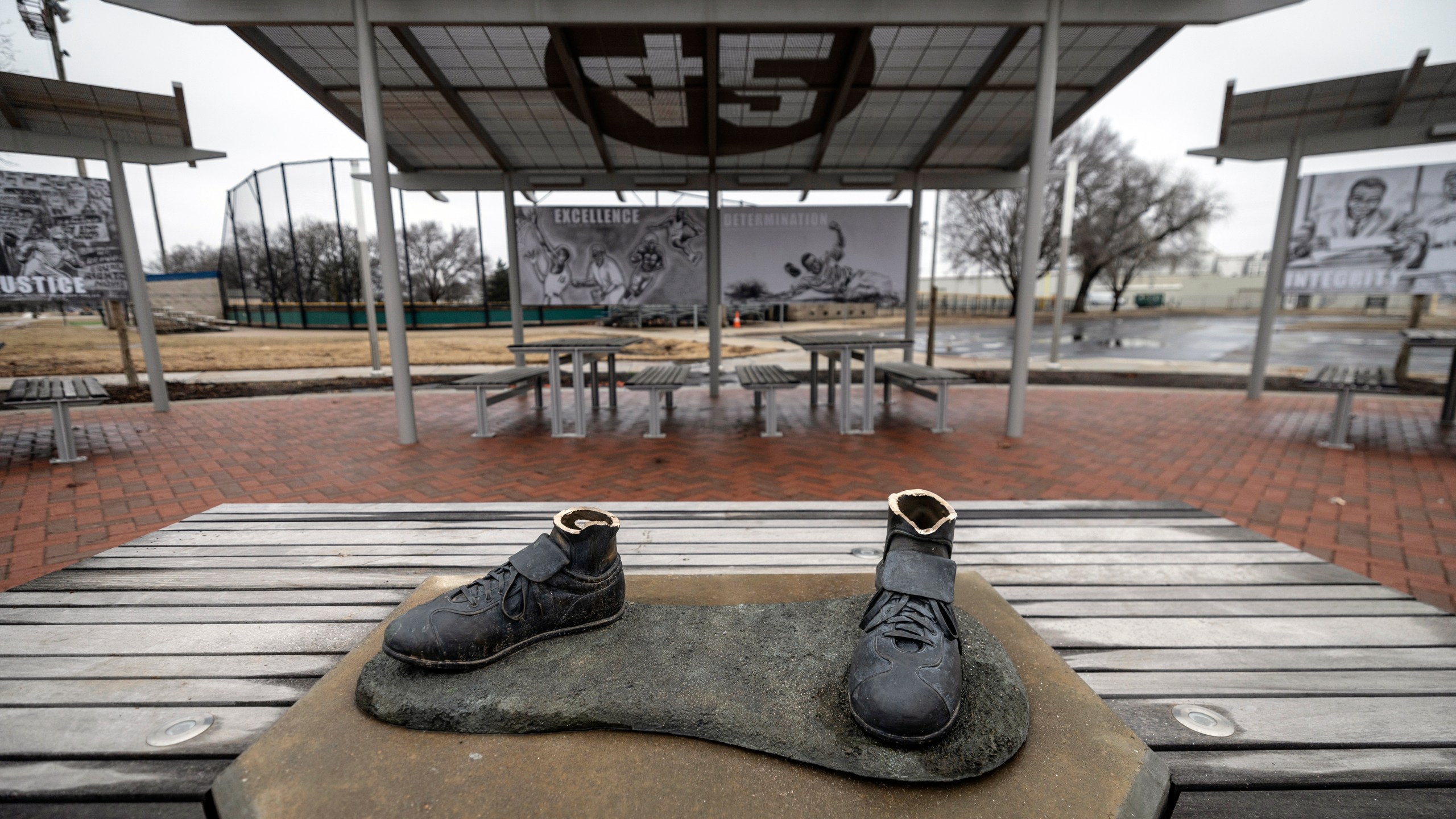 A bronze statue of legendary baseball pioneer Jackie Robinson was stolen from a park in Wichita, Kan., during the early morning hours of Thursday, Jan. 25, 2024. The statue, valued at $75,000, was the centerpiece of the League 42 ballpark facility, a baseball league started in 2015 to help kids with little access to organized sports. The league currently has 600 kids signed up to play this spring. Wichita police said during a Friday news conference that they are working desperately to catch the thieves. (Travis Heying/The Wichita Eagle via AP)