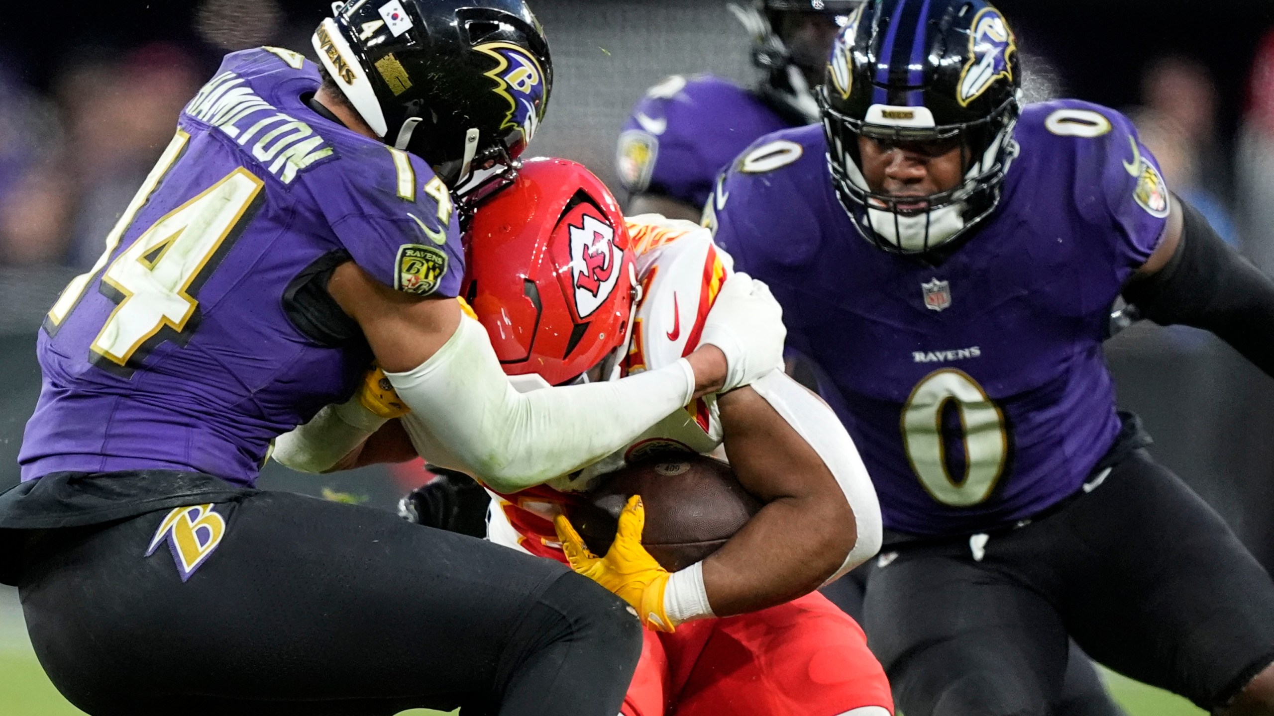 Kansas City Chiefs running back Clyde Edwards-Helaire (25) is hit by Baltimore Ravens safety Kyle Hamilton (14) during the second half of an AFC Championship NFL football game, Sunday, Jan. 28, 2024, in Baltimore. (AP Photo/Alex Brandon)